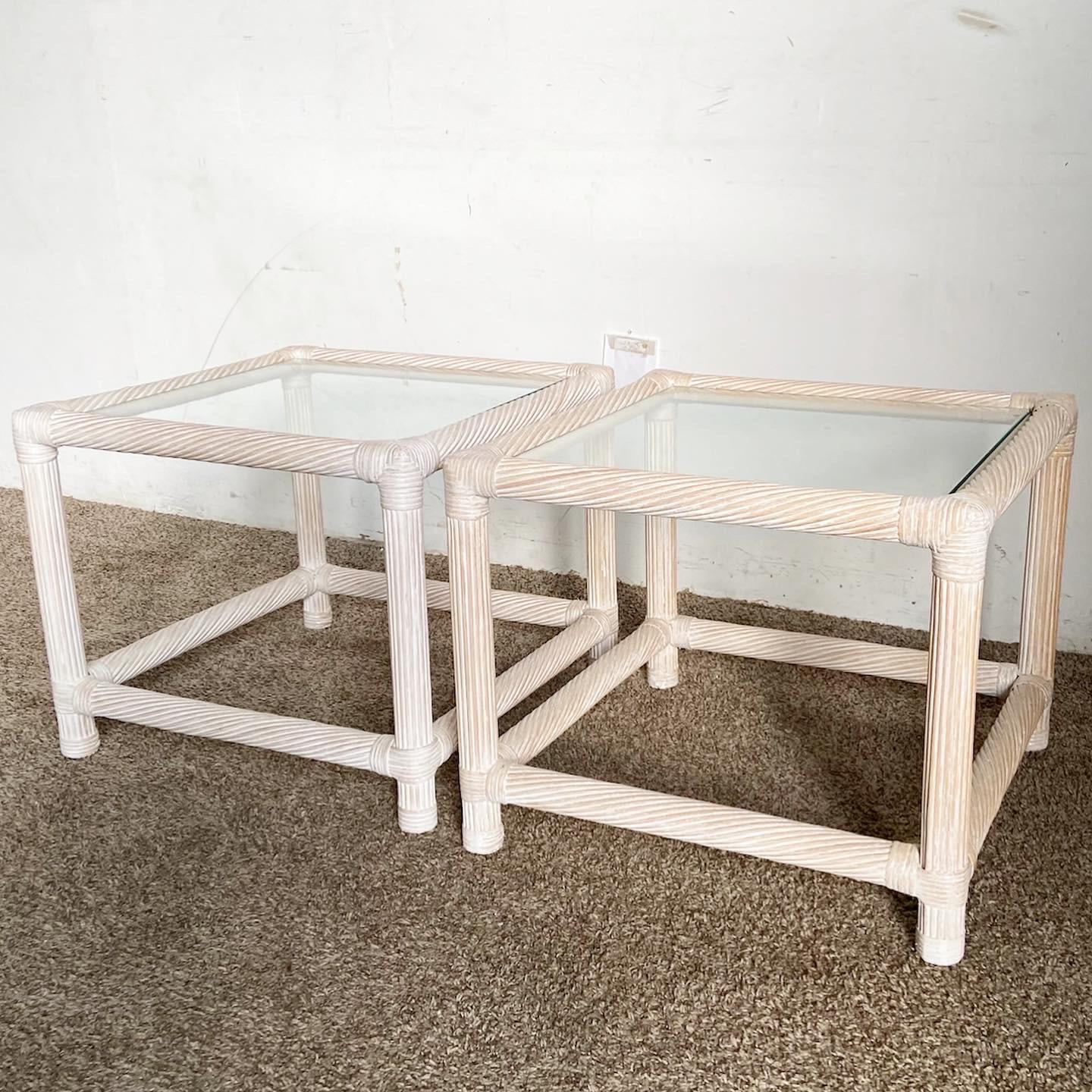 Introduce a touch of Boho Chic with this pair of side tables. Featuring spun pencil reed and rattan bases with sleek glass tops, they blend organic textures with modern elegance.
Minor wear on these Boho Reed Rattan Side Tables as seen in the photos.