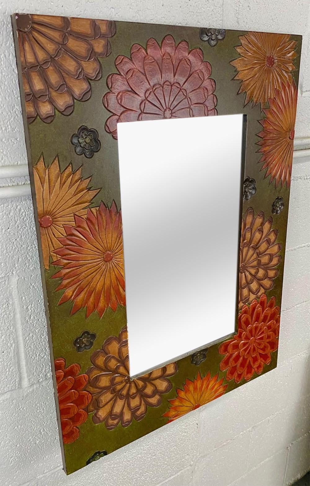 A beautiful Boho Chic wall or vanity  mirror. The stylish mirror is made of a hand carved frame featuring sun flowers motifs on a green background. The earthy color tone of the frame adds class and elegance to the minor.  the mirror will look