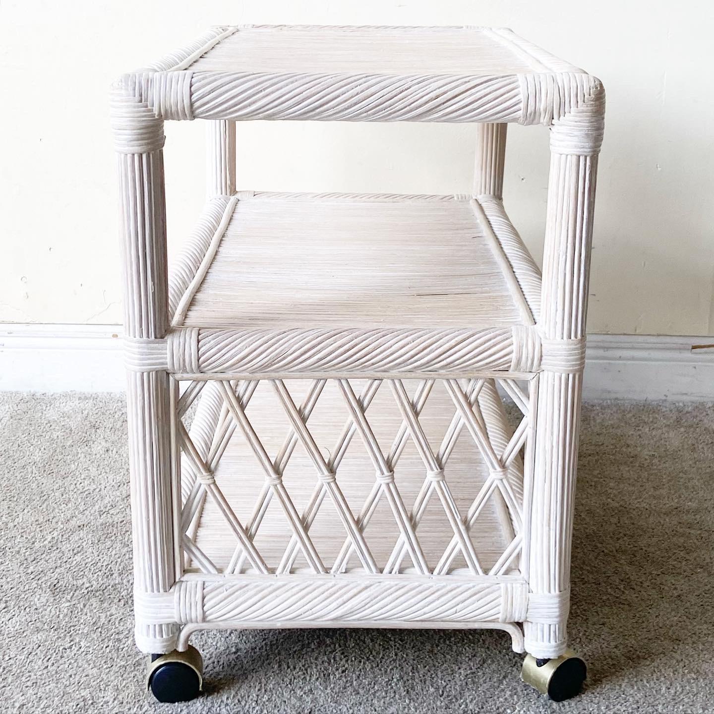 Exceptional bar cart with a whitewash finish. Features twisted pencil reed and rattan frame.
 