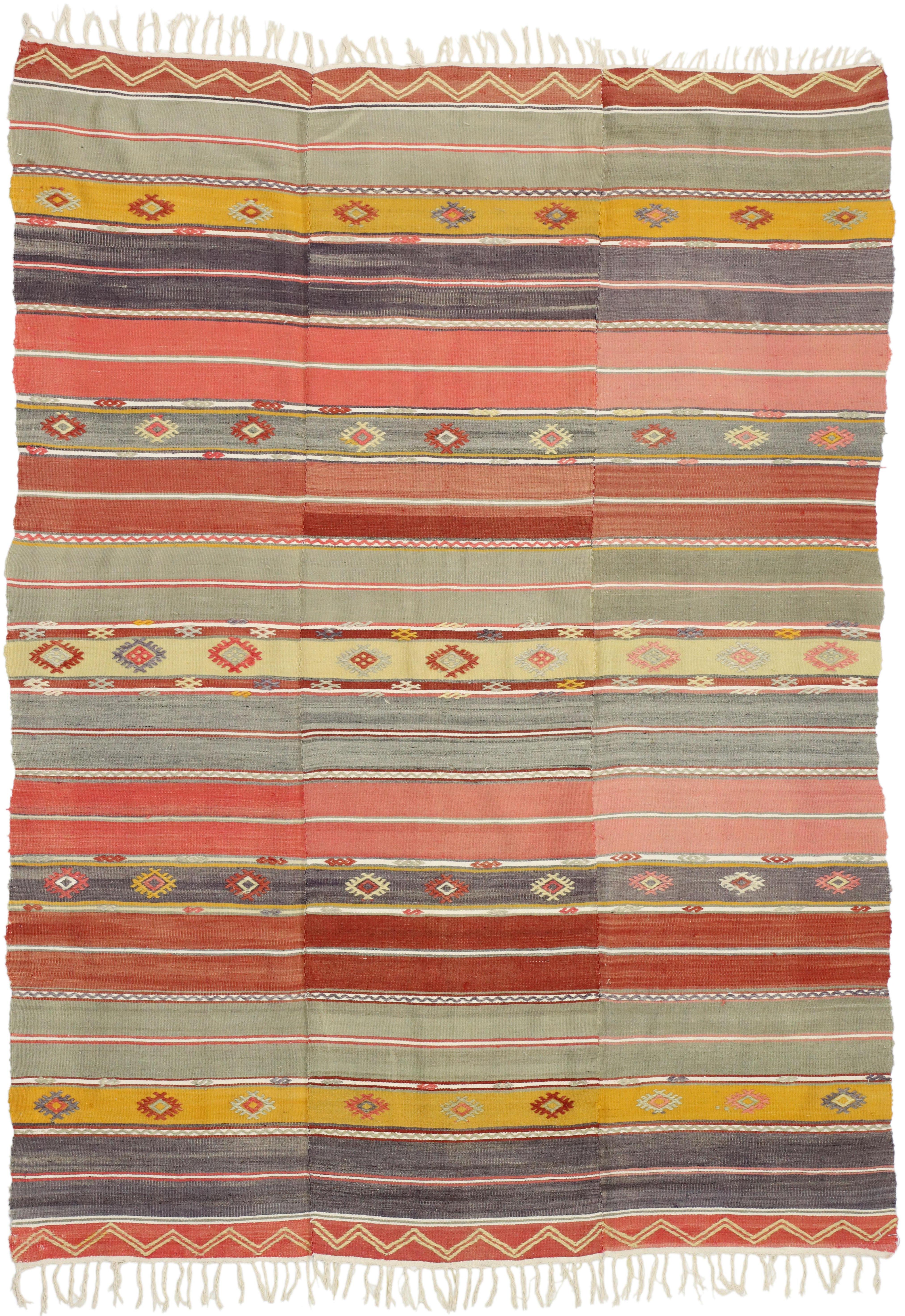 51277 Boho Chic Vintage Turkish Kilim Rug, Flat-Weave Rug with Tribal Style. This vintage Turkish Kilim rug features multicolor geometric tribal motifs and stripes sit on a warm brown background. This kilim rug is rich in Turkish culture, as the
