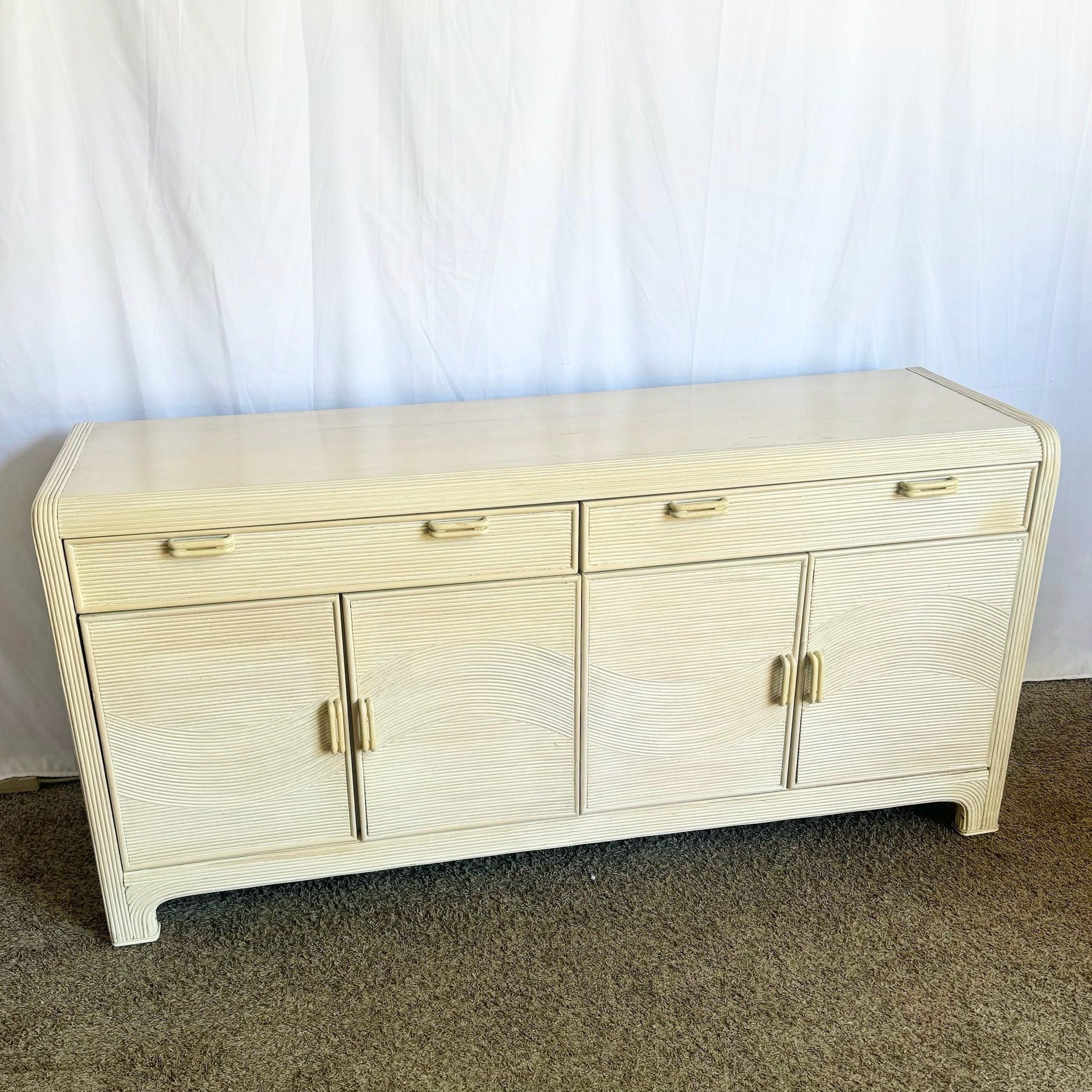 Boho Chic Wavy Pencil Reed Credenza by American Drew, featuring a captivating wave design and refined craftsmanship—stylish and practical for any room.
 
 Some wear to the top, ages edges and handles as shown in the photos.
 
 We sell items as