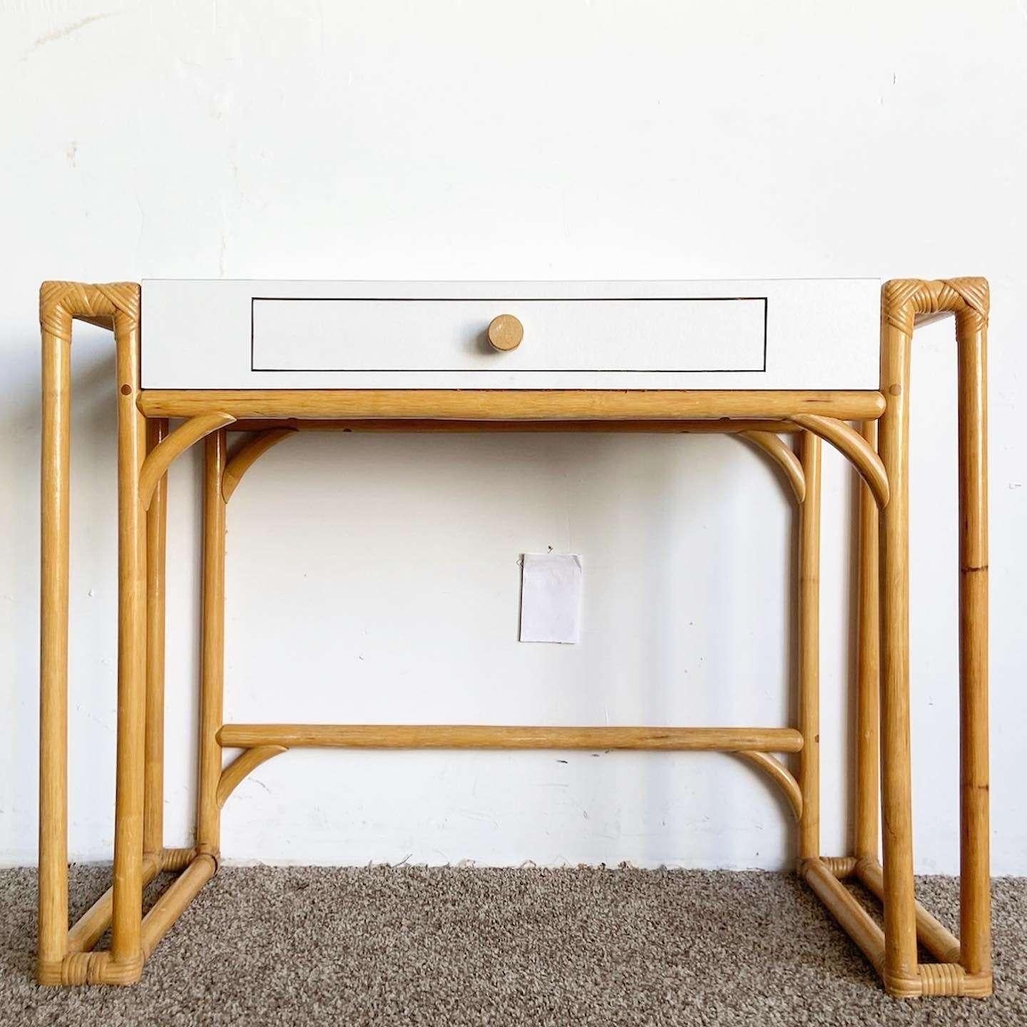 Incredible vintage boho chic writing desk. Features bamboo rattan frame with a matte white laminate table top with one central drawer.