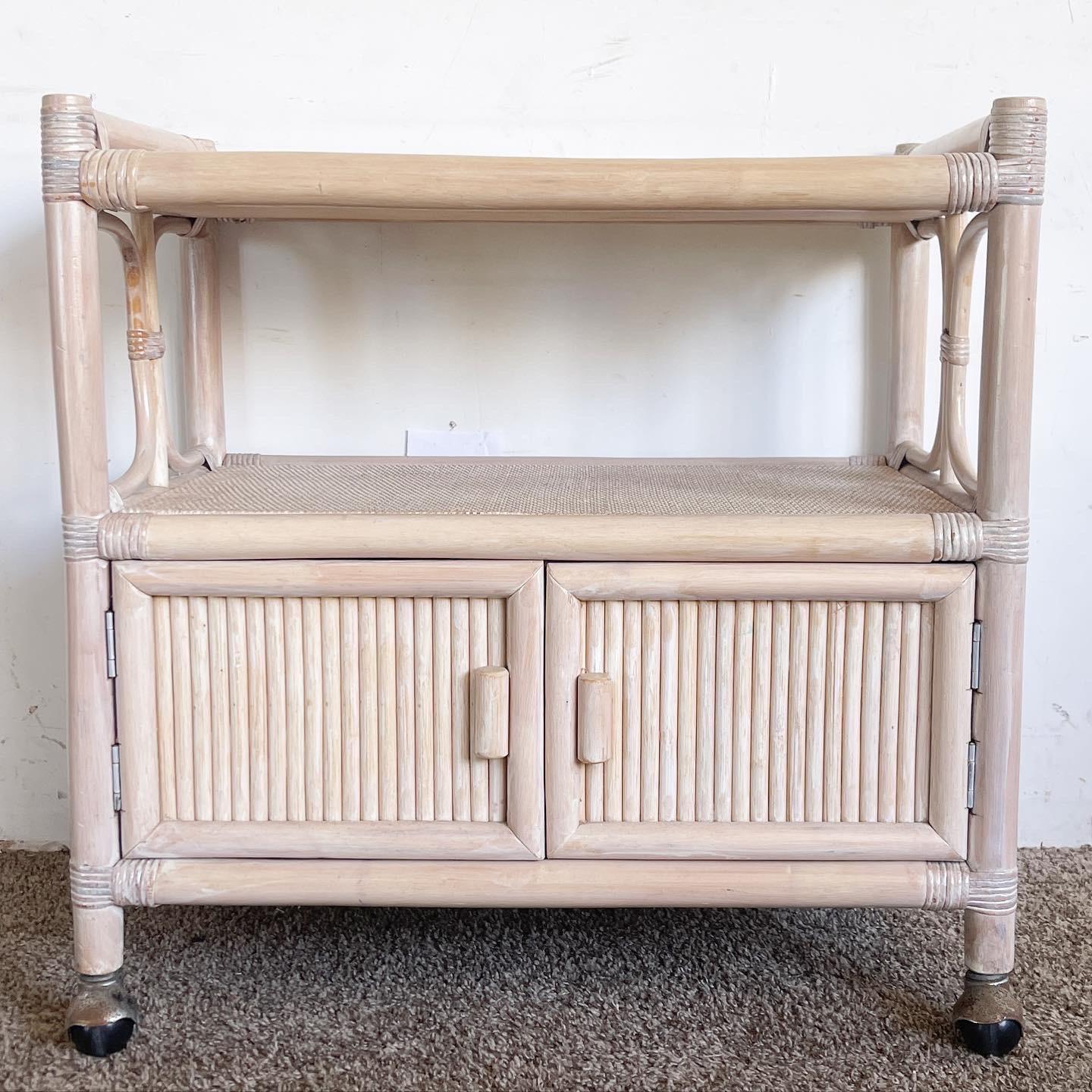 Elevate your home's ambiance and infuse a touch of bohemian elegance into your entertaining space with this exquisite White Washed Rattan Bar Cart, a stunning piece that not only showcases the beauty of natural materials but also exudes a timeless
