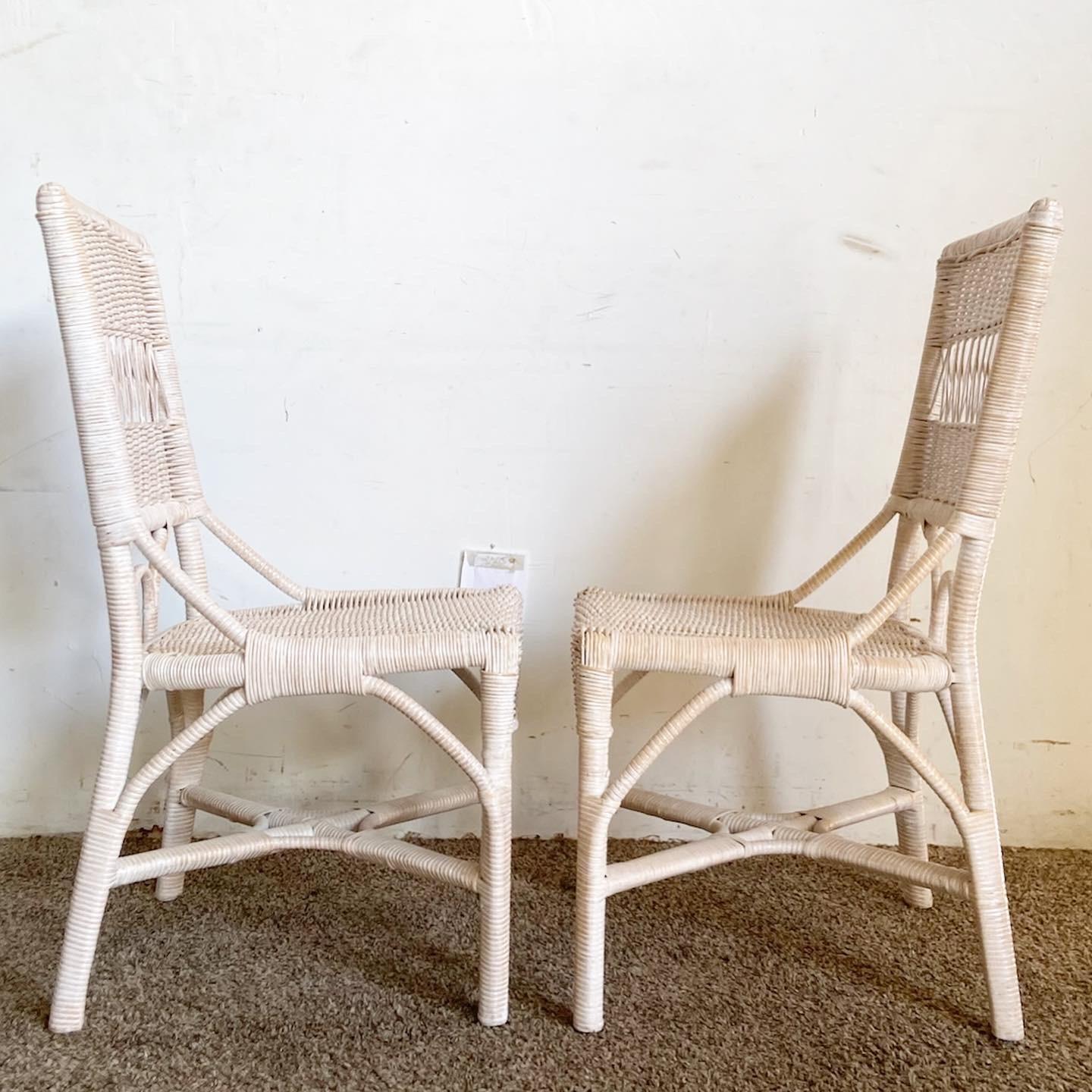 Introduce a touch of bohemian elegance with the Boho Chic White Washed Wicker Rattan Side Chairs. This pair, crafted in wicker and rattan, boasts a timeless white-washed finish. Their intricate detailing and textured appeal make them a blend of