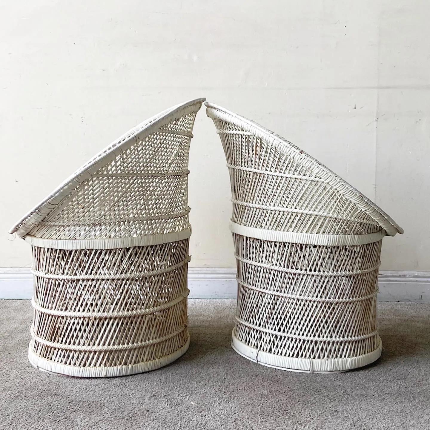 Amazing pair of boho chic wicker and rattan side chairs. Each, painted white, feature a sculpted seat/backrest which sits on a pedestal base.

Additional information:
Materials: Rattan, Wicker
Color: White
Style: Boho Chic
Time Period: