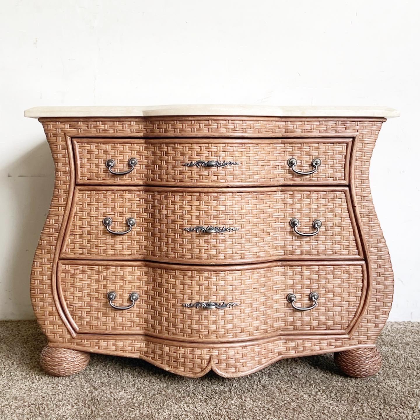 Our Boho Chic Wicker Tessellated Stone Top Chest of Drawers melds rustic charm with modern elegance. This handcrafted piece with ample storage space is a blend of functionality and style.

Handcrafted, brown wicker construction.
Unique tessellated
