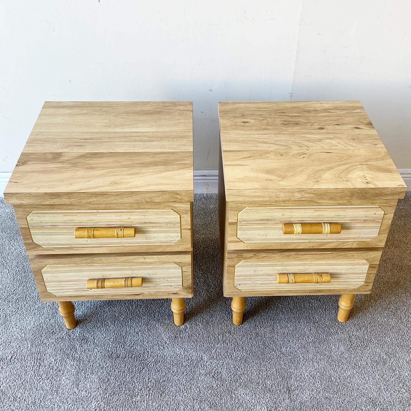 Amazing pair of woodgrain laminate Nighstands. A marriage of postmodern and boho style. Features faux bamboo handles and legs. These were made in Lantana, Florida.
