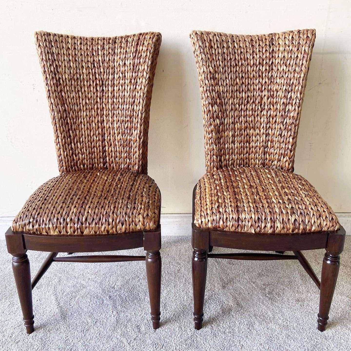 Exceptional set of 4 vintage boho chic dining chairs. Each feature a traditional wooden base with a woven sea grass back rest and seat.

Seat height is 19.0 in
