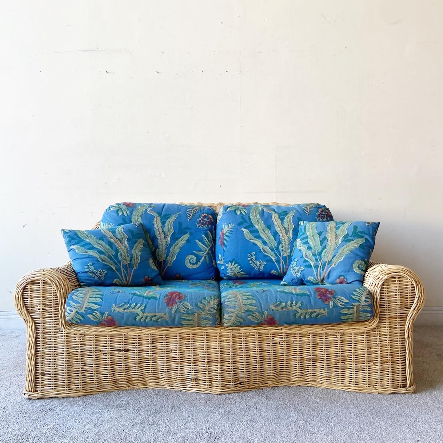 Amazing vintage bohemian wicker love seat sofa. Features a fantastic sculpted wicker throughout the entire sofa. Cushions can be left out if desired.