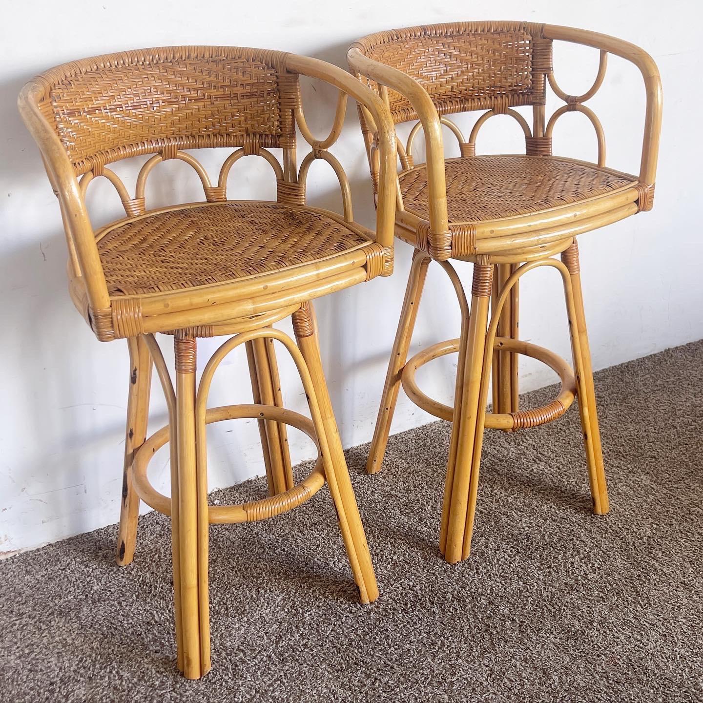 Add casual elegance with the Bamboo Rattan Wicker Swivel Stools, a pair designed to bring Boho Chic flair and functionality to your home.

Constructed with bamboo legs and rattan woven seats for a natural, tropical appeal.
Wicker accents and swivel