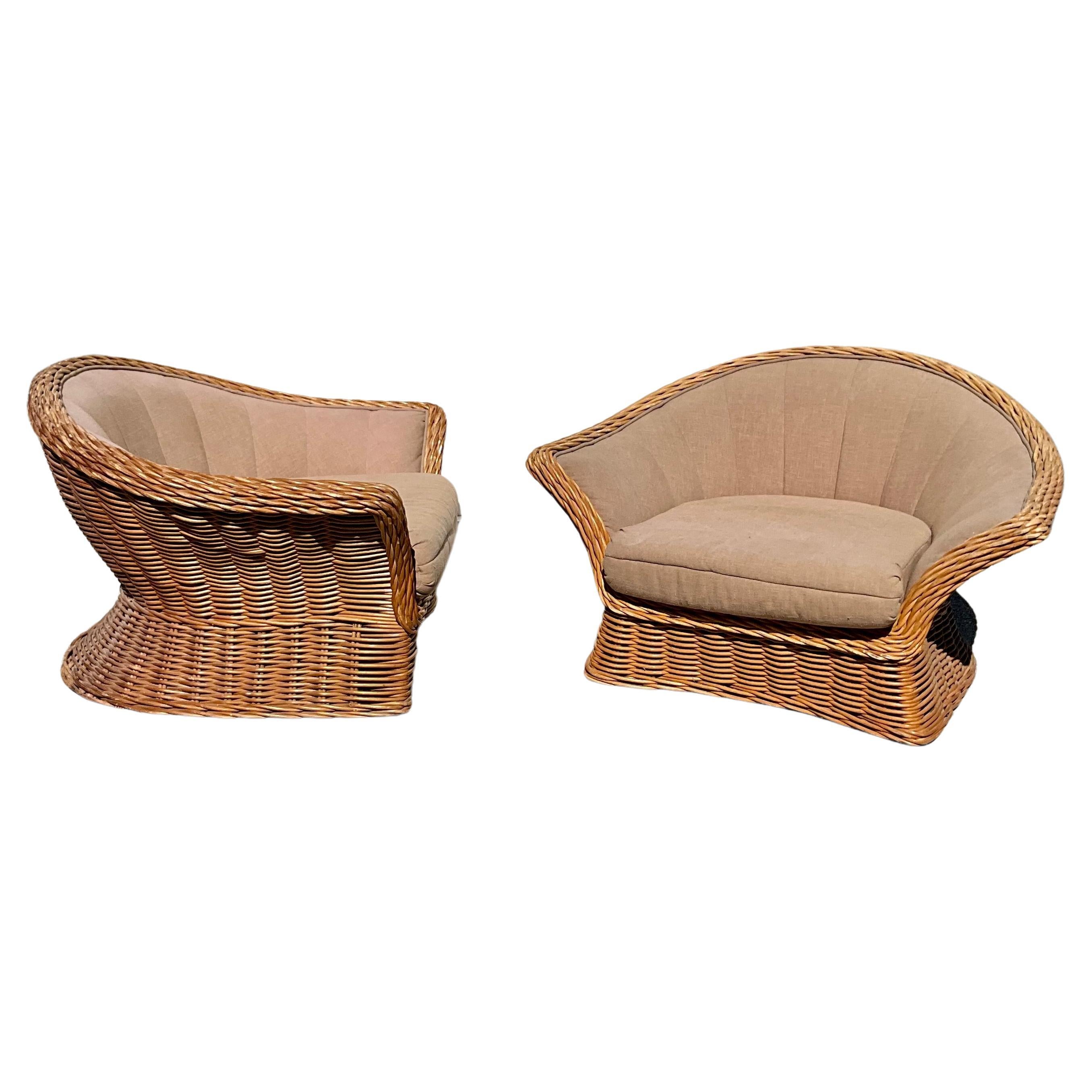Oversized  well proportioned woven rattan Boho coastal lounge chairs.  These chairs are very well made in the manner of Bielecky Brothers They have deep very comfortable cushions.  In original fabric ready for new unpholstery.  A entire suite was