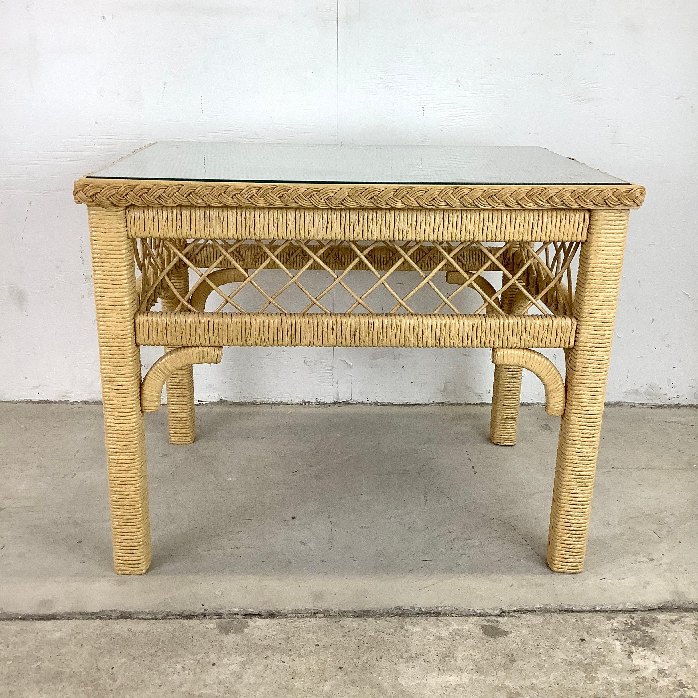 This bohemian Henry Link style Wicker and Glass Top Side Table, a captivating piece that combines bohemian flair with timeless elegance. This unique side table showcases intricate wicker craftsmanship and adds a touch of exotic charm to any