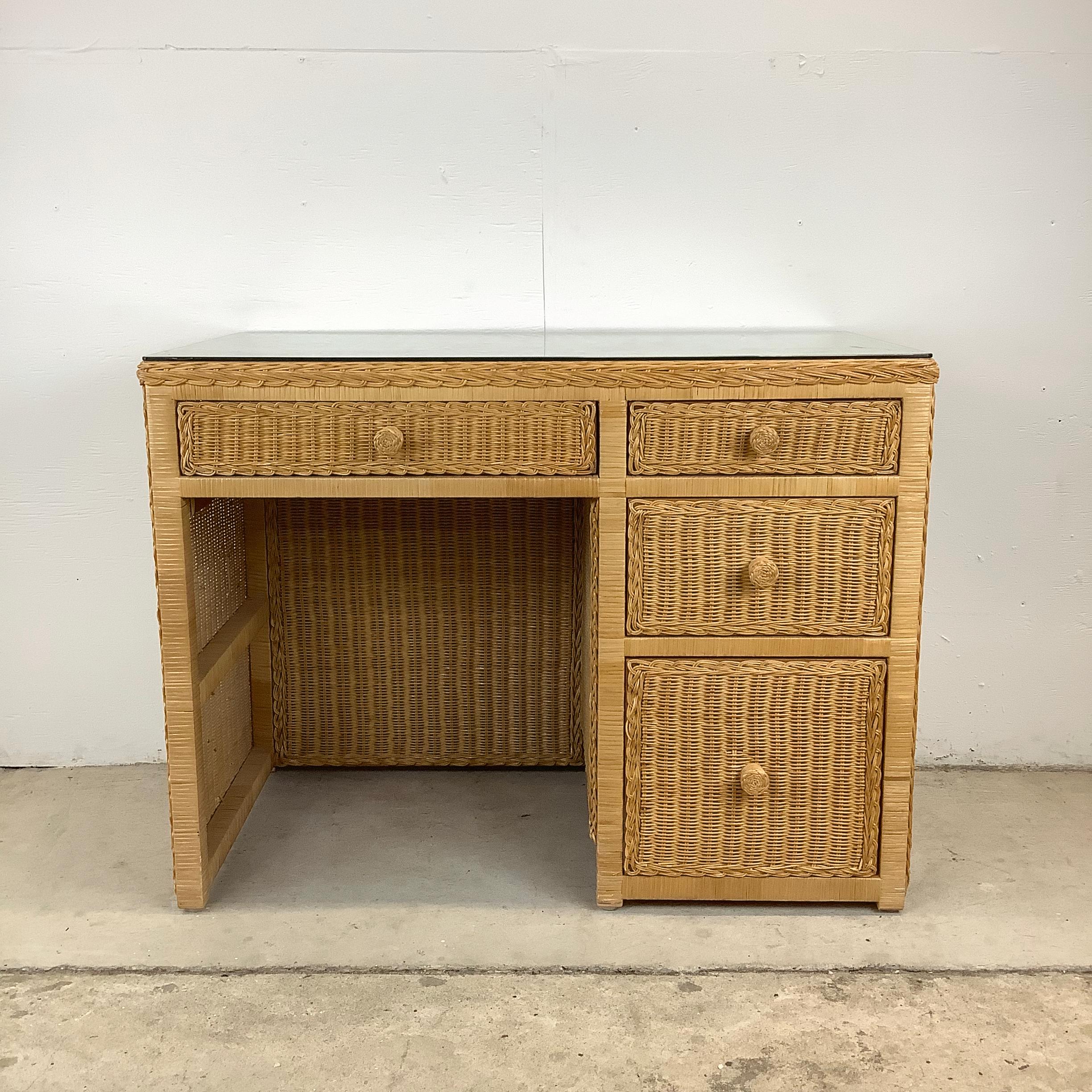 Step into a world of vintage charm with this stunning wicker writing desk! This exquisite piece, reminiscent of the elegant designs from the 1970s, effortlessly combines functionality with an aesthetic appeal that is sure to elevate any home office
