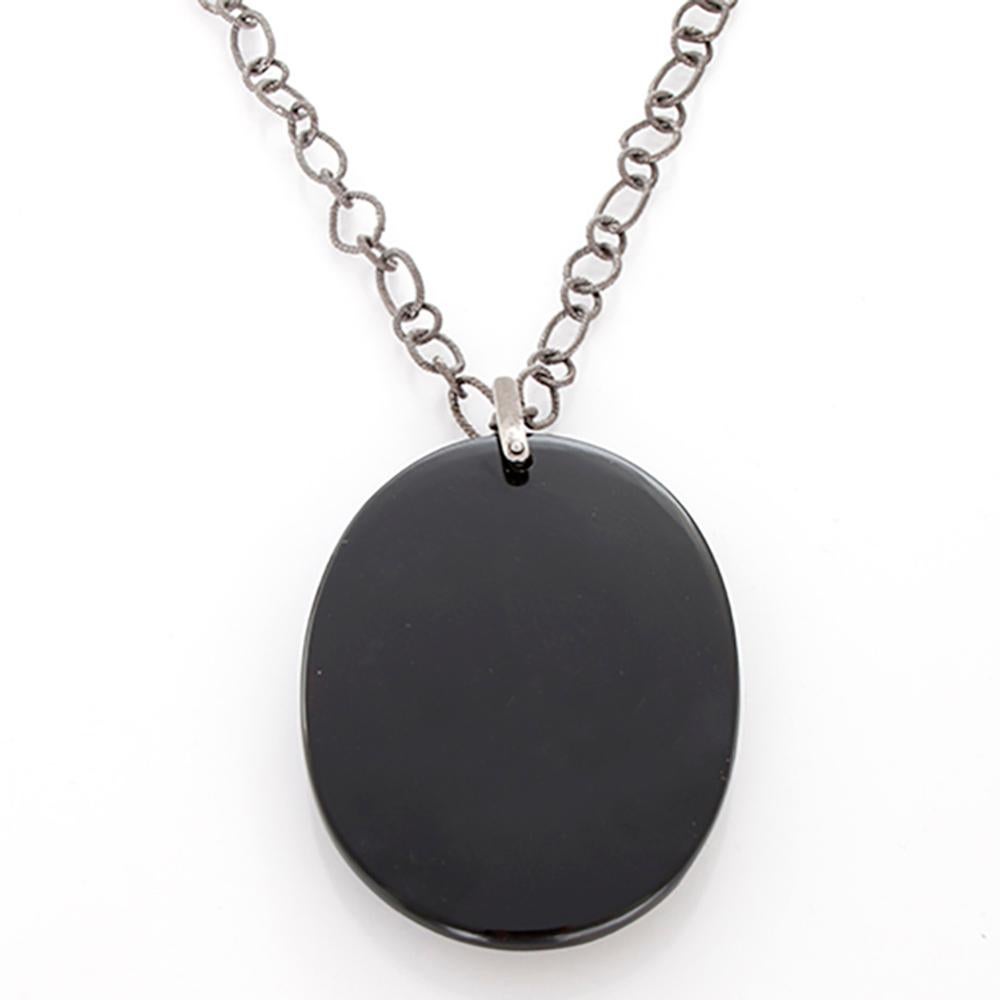 This boho inspired necklace features a black diamond and onyx pendant on an oxidized sterling silver chain. Pendant measures apx. 2-inches in width and apx. 3-inches in length including bale. Chain measures apx. 34-inches in length. Total weight is