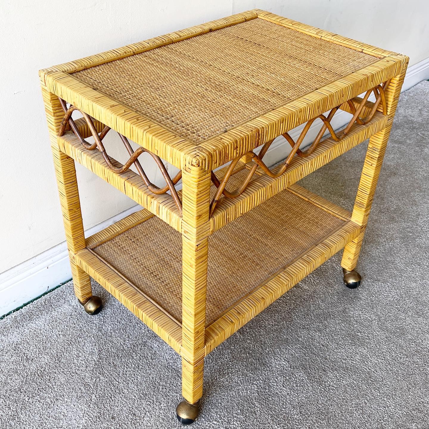 Amazing rattan cart with a wicker top and bottom tier. Cart glides smoothly on spherical wheels.

Additional Information:
Material: Rattan, Wicker
Color: Brown
Style: Boho Chic
Time Period: 1980s
Dimension: 26