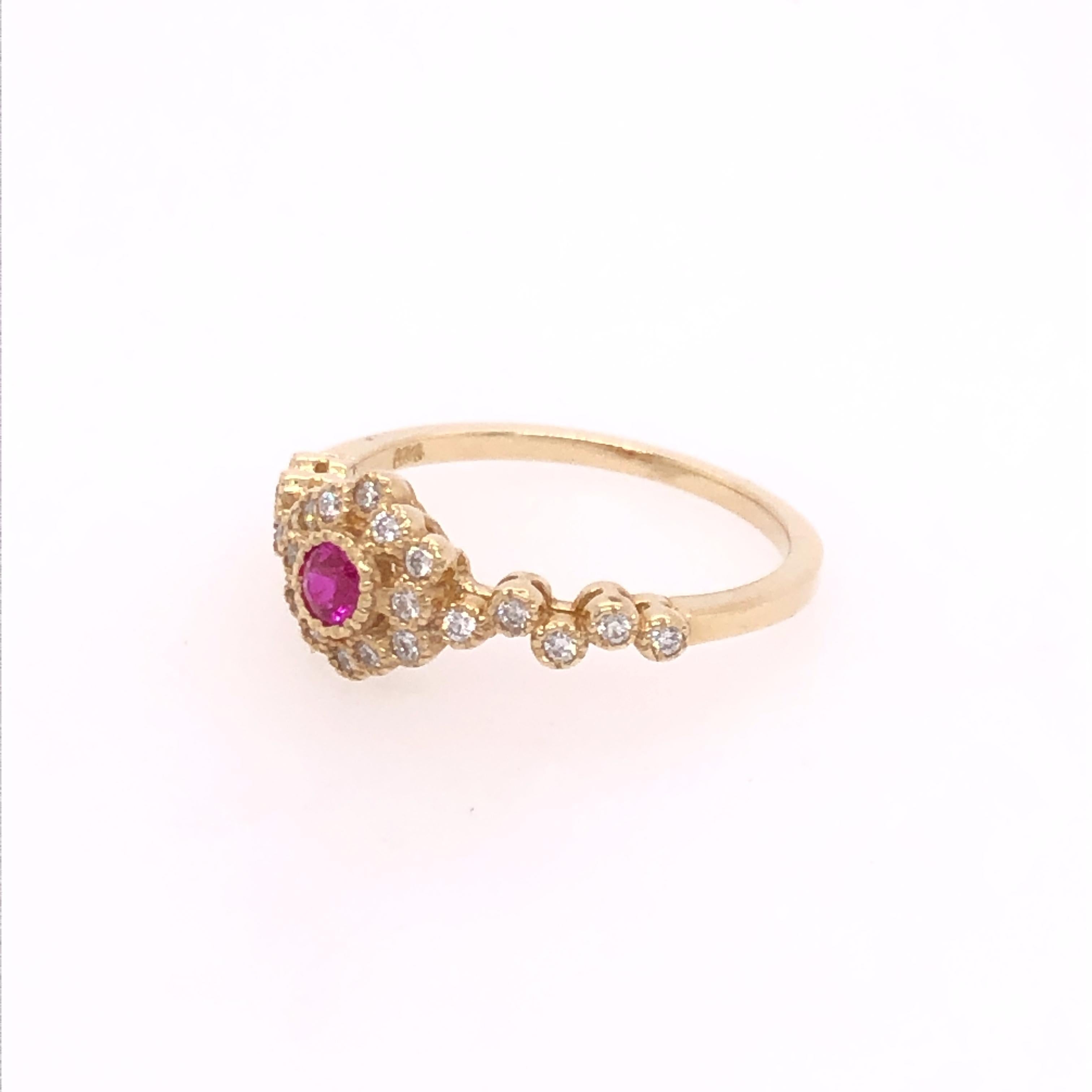 This Bohemian style ruby and diamond ring is perfect for everyday. Its low profile makes it practical to wear while the whimsical design creates a delightful sense of fantasy to the wearer. A 0.08 ruby sits in the center of a hexagonal halo of 12