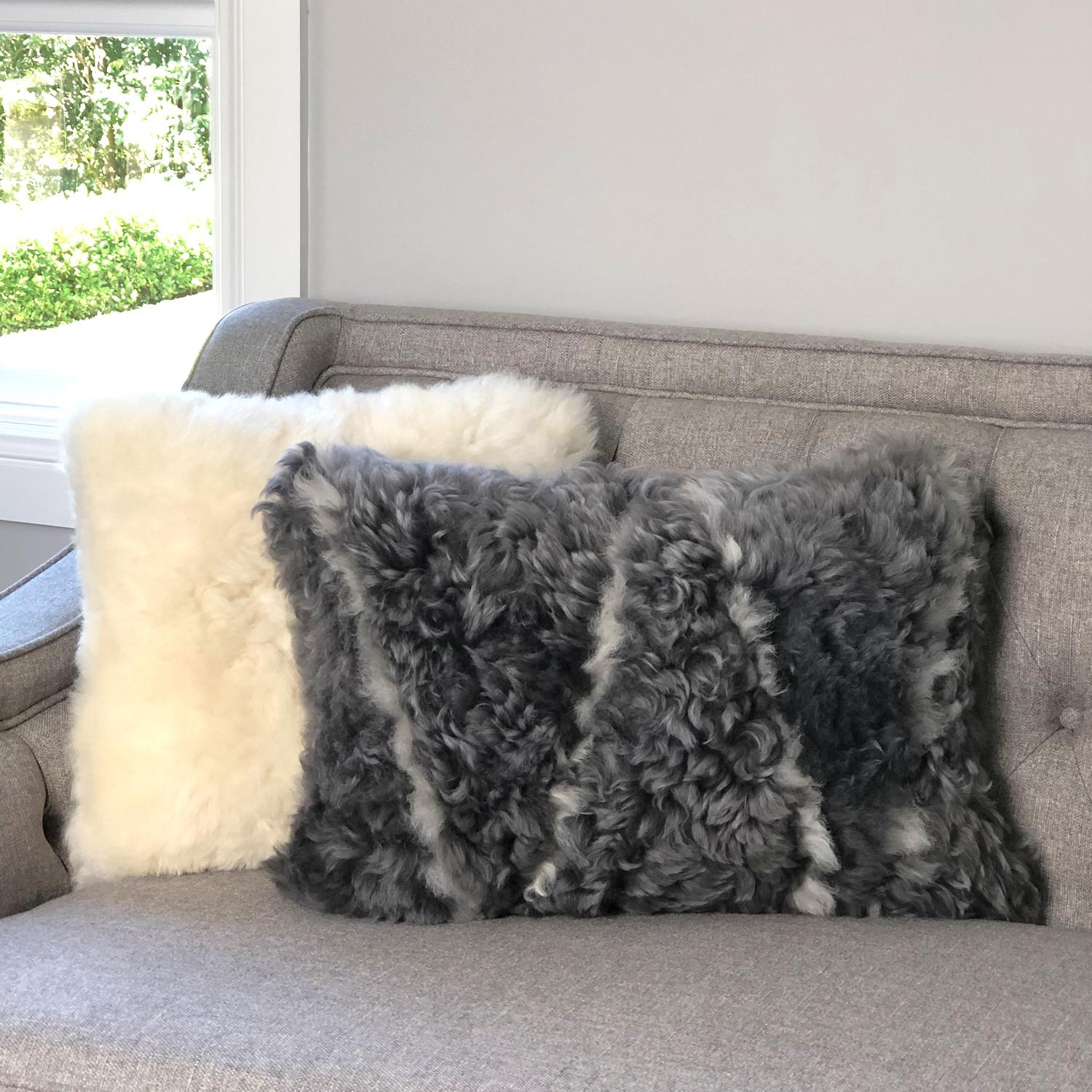 Add comforting and luxe textures to your decor with this plush grey and white sheepskin pillow. Made from the finest eco-friendly sheepskins, guaranteed to not have been processed through harsh and toxic chemicals. Our eco choice Icelandic