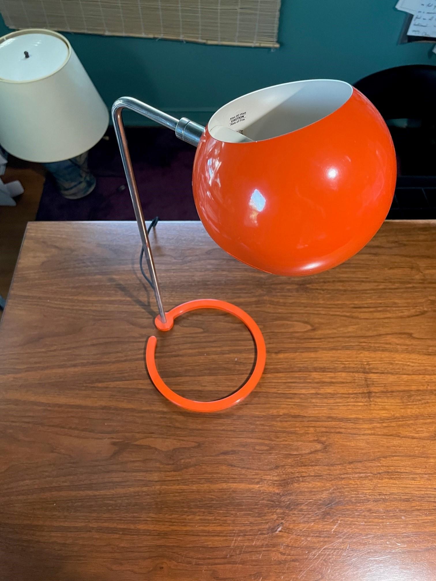 Beautiful David Weeks Studio 'Boi' Table Lamp in Orange Gloss Exterior Finish, Ivory Satin Interior. Features a powder coated steel shade and weighted ring base. The shade rotates 320 degrees to cast light directionally. Shade and base is powder