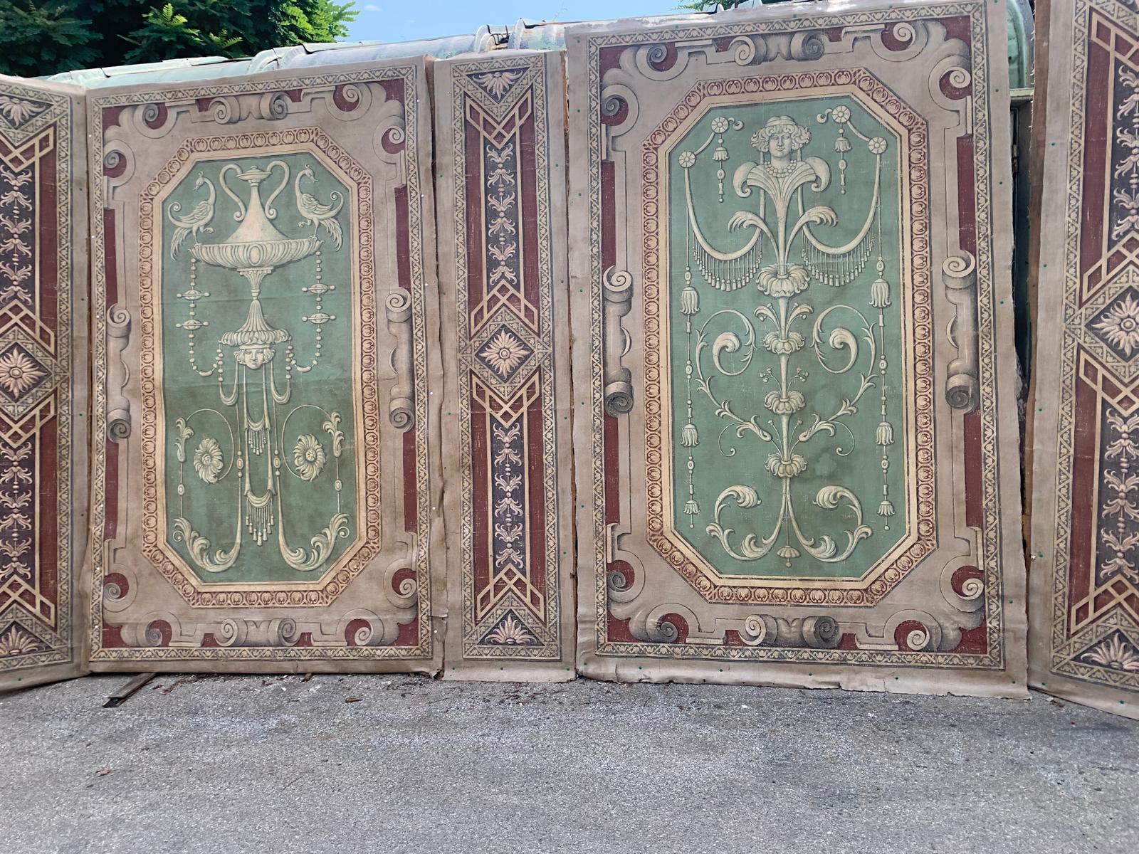 Antique Boiserie richly painted on canvas, Composed of five decorated panels. 
The paneling is punctuated by vertical squares, bordered by frames painted with geometric patterns in red and ivory, with rhombuses and woven decorations. In particular,