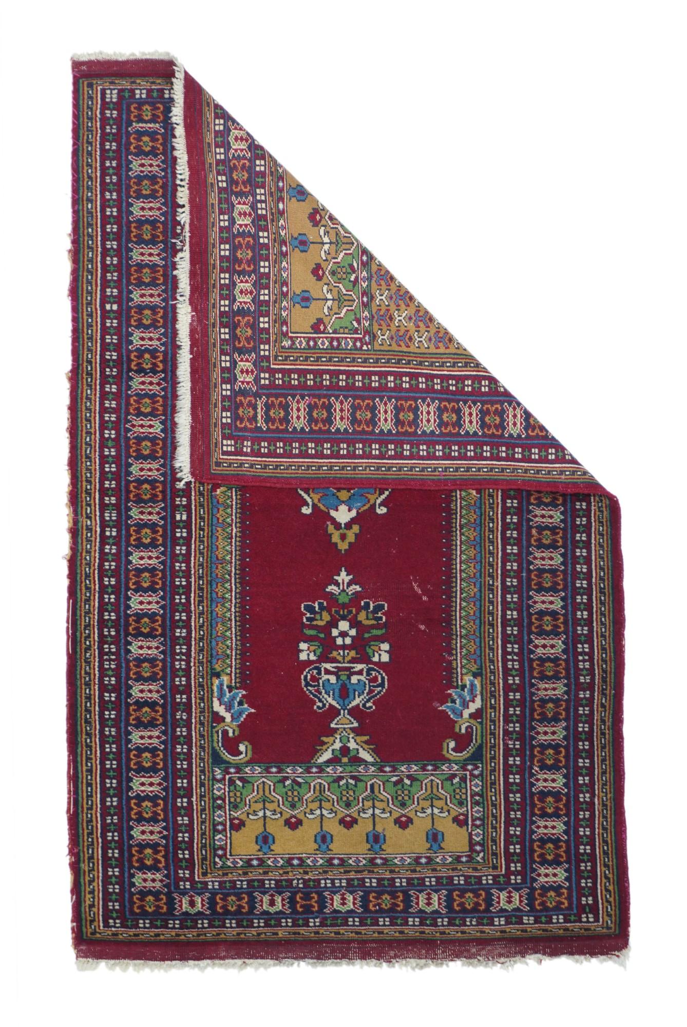 Bokhara Rug 2'7'' x 4'3''. In a general Ghiordes Turkish style with a red lobed niche supported by side colonettes, suspending a mosque lamp from the apex and centred by a flower-filled vase beneath. Deep spandrel section with humanoid X pattern.