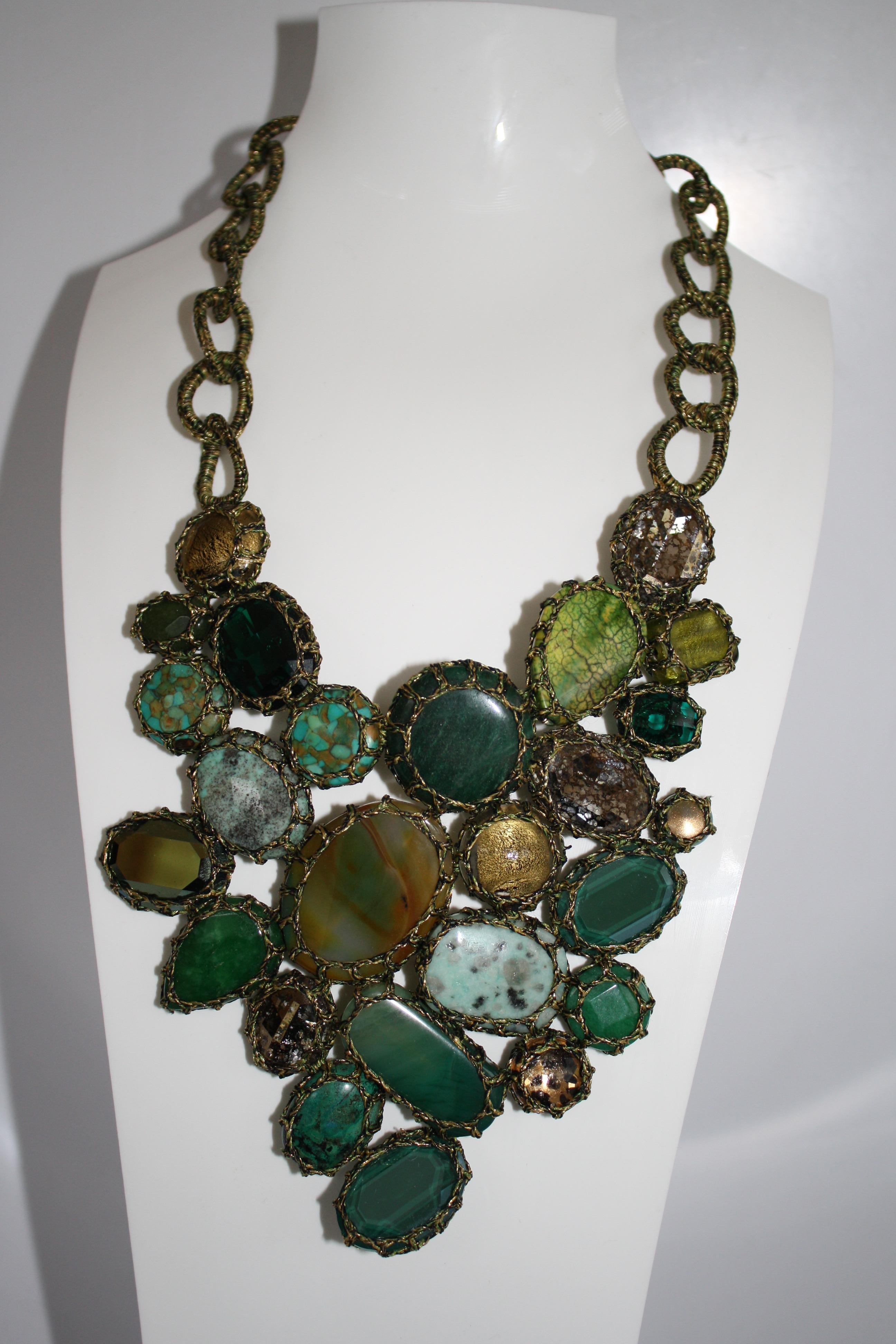 From Boks & Baum Paris, this fabulous statement piece is made with Lurex, Rayon, Swarovski Crystal, African Turquoise, Agate, Amazonite, Aventurine, Chrysoprase, Jade, and Murano glass.    

18