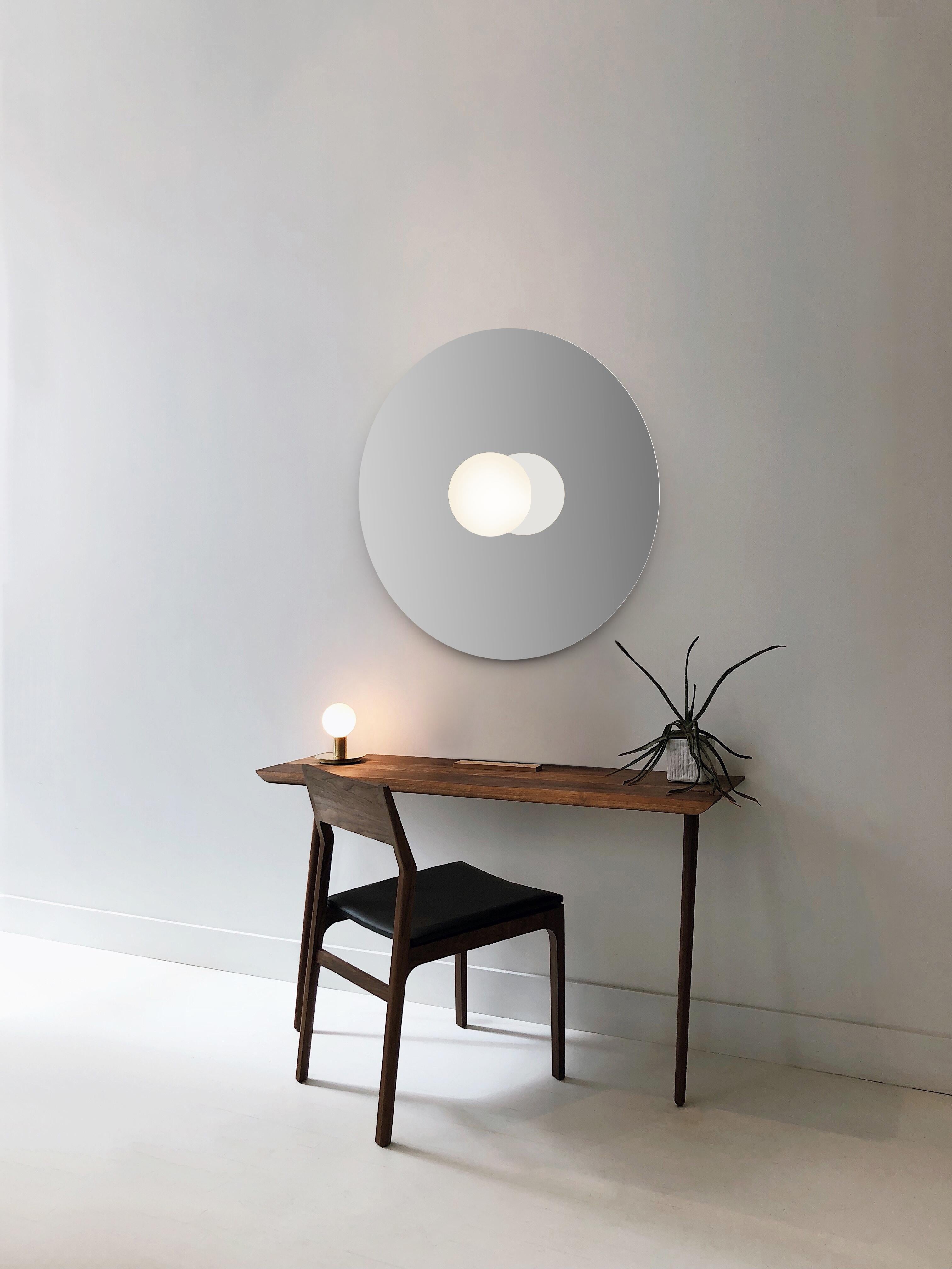A study in refined simplicity, bola disc flush offers a magical combination of mirror and globe refined down to its bare essentials. The objective with the Bola Disc Flush is to provide both direct and reflected light from either ceiling or wall