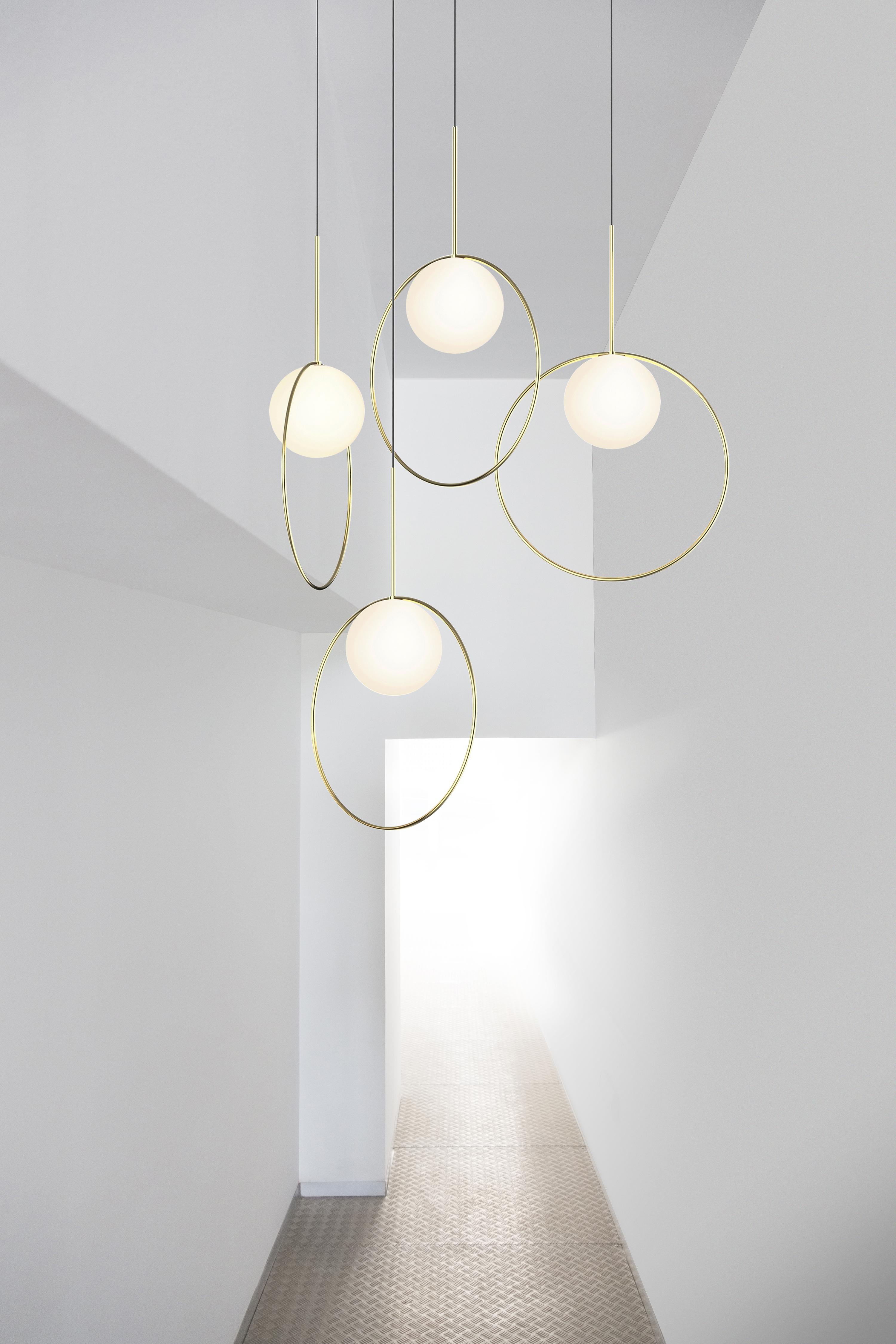 Taking its inspiration from pendant jewelry, Bola Halo is a uniquely expressive pendant light featuring a chromated ring that balances delicately over its elegant opal glass shade while allowing its surroundings to shine through. Available in 3