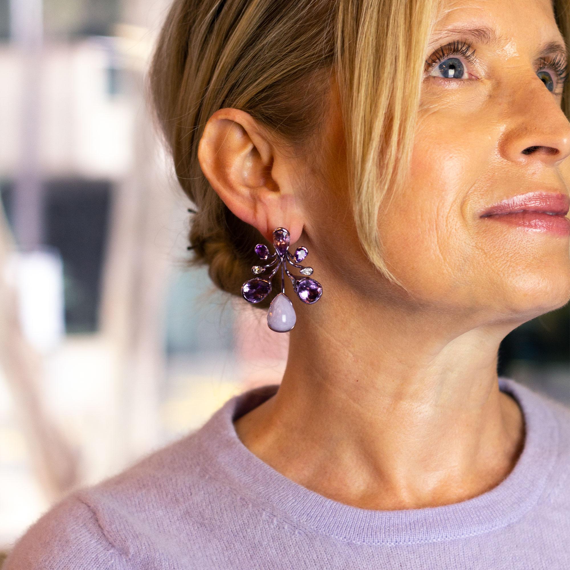 A pair of 18 karat purple plated white gold, lavender jade, amethyst, diamond and tourmaline drop earrings by Brazilian designer Fernando Jorge. This pair of versatile earrings feature a detachable central 'drop' earring comprising of a piece of