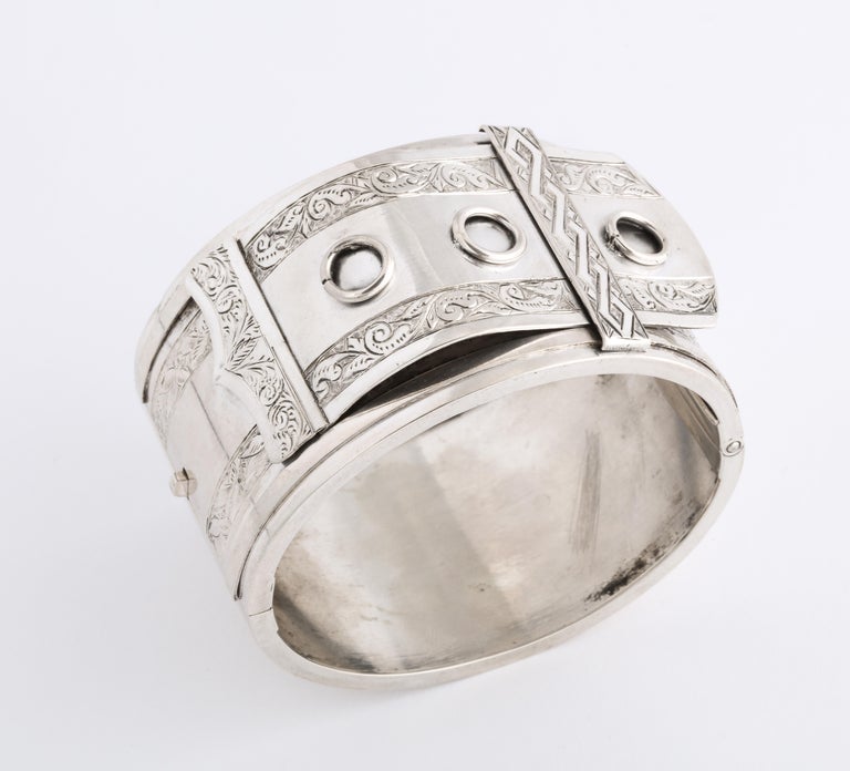 Stunning in its bold and graphic design and in its size, this dramatic cuff is Victorian sterling silver of the 19th century though it looks modern and timely. It is a buckle motif but a rare one. I have not seen its like in my 37 years of business.