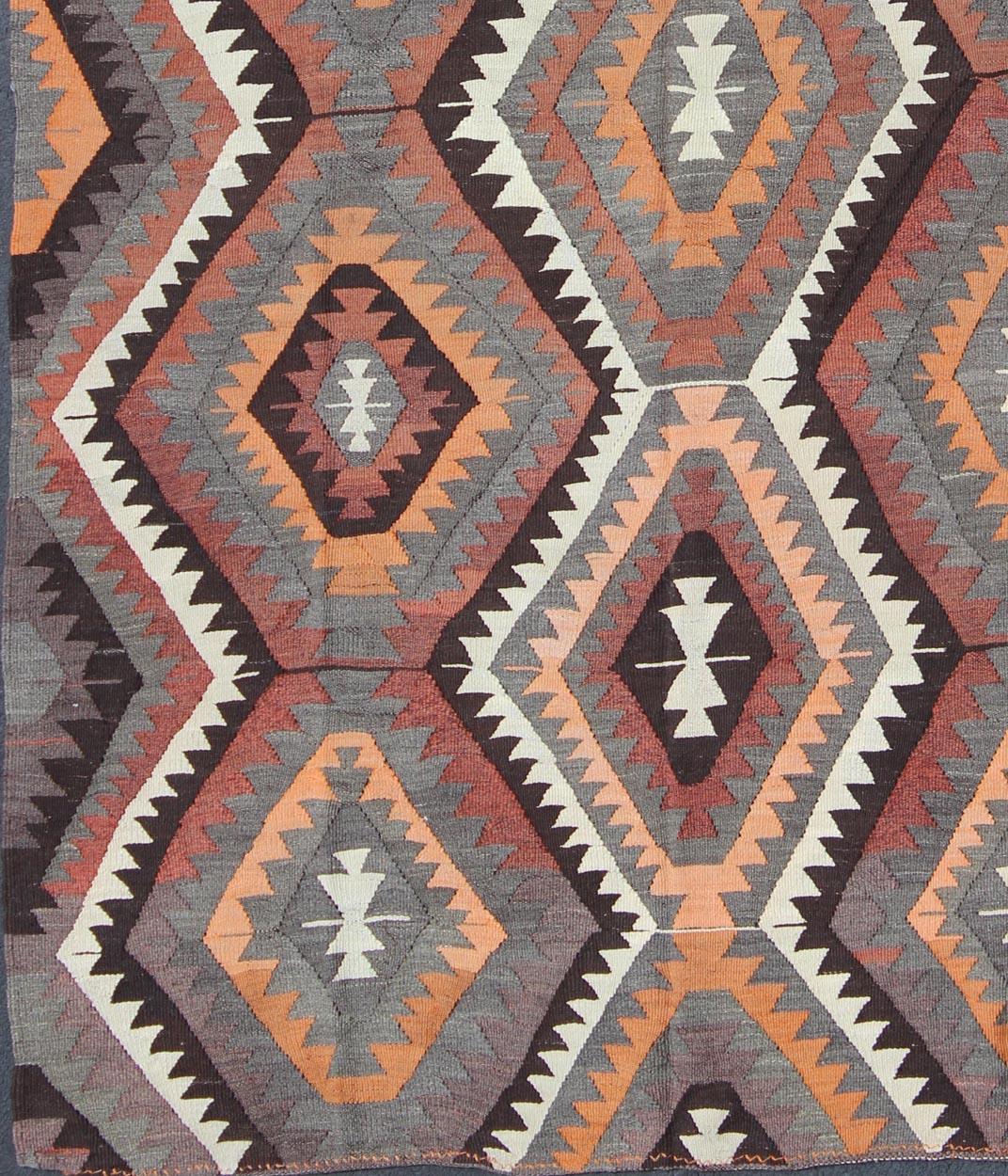 Bold design and geometric design Turkish flat-weave Kilim rug
Colorful vintage rug with Fun Geometric pattern, rug tu-ned-7, country of origin / type: Turkey / Kilim, circa 1950

This flat-woven kilim rug from Turkey features a bold geometric