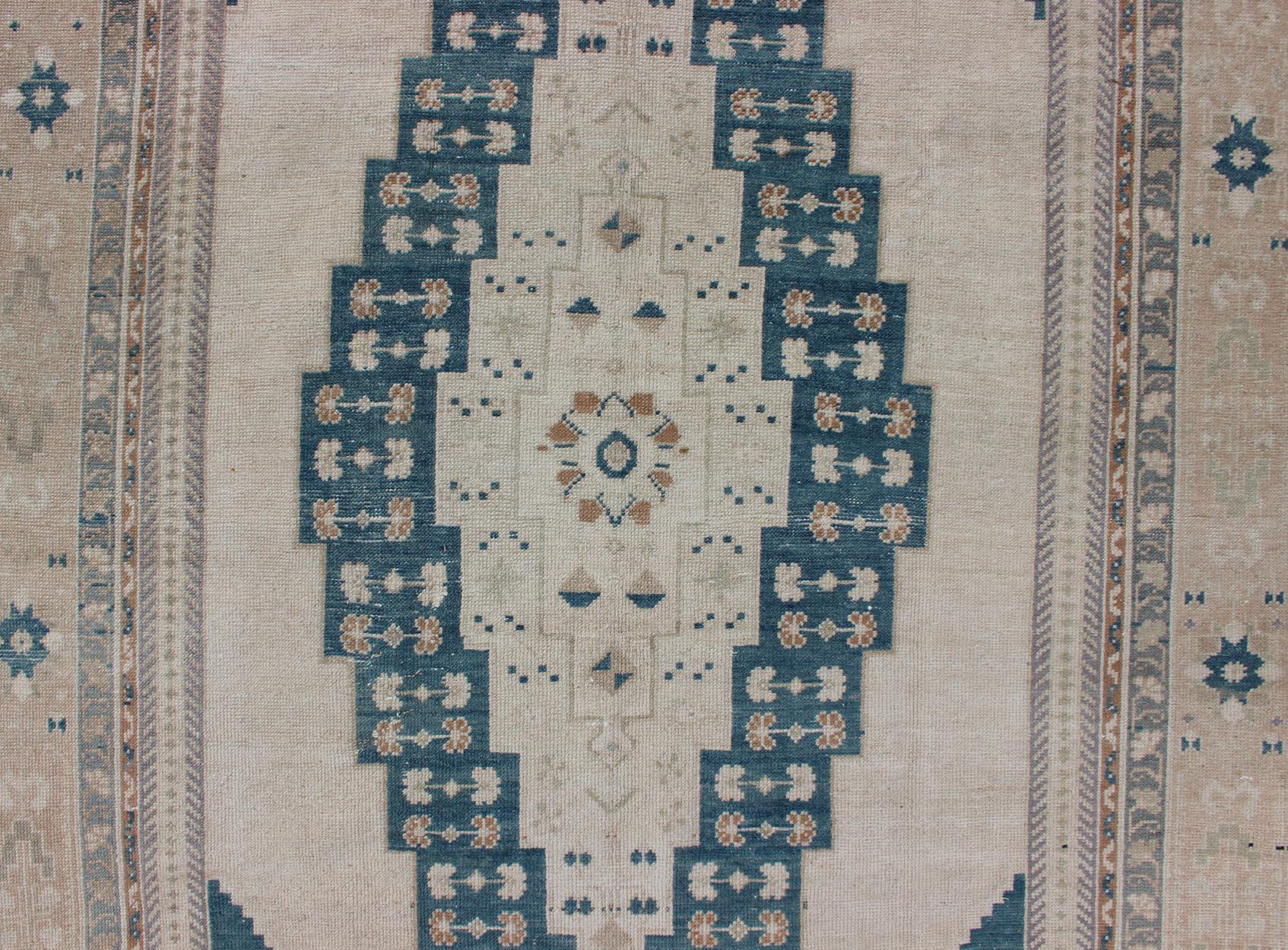 Hand-Knotted Bold Design Blue and Cream Turkish Oushak with Stretched Medallion For Sale