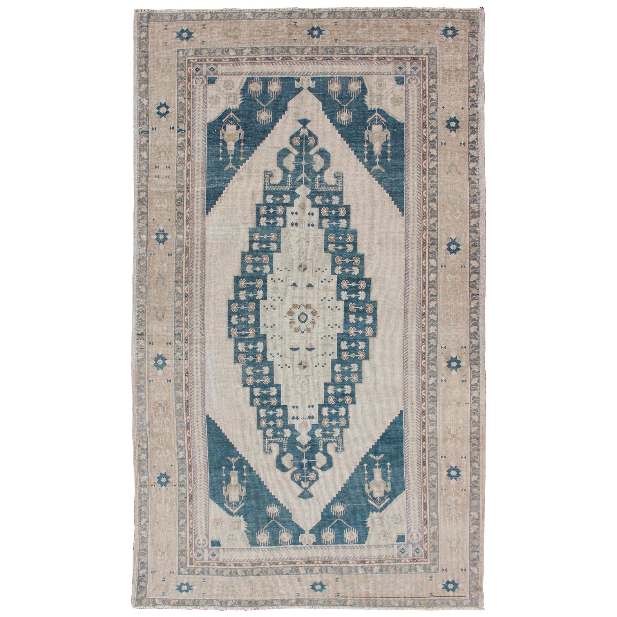 Bold Design Blue and Cream Turkish Oushak with Stretched Medallion For Sale