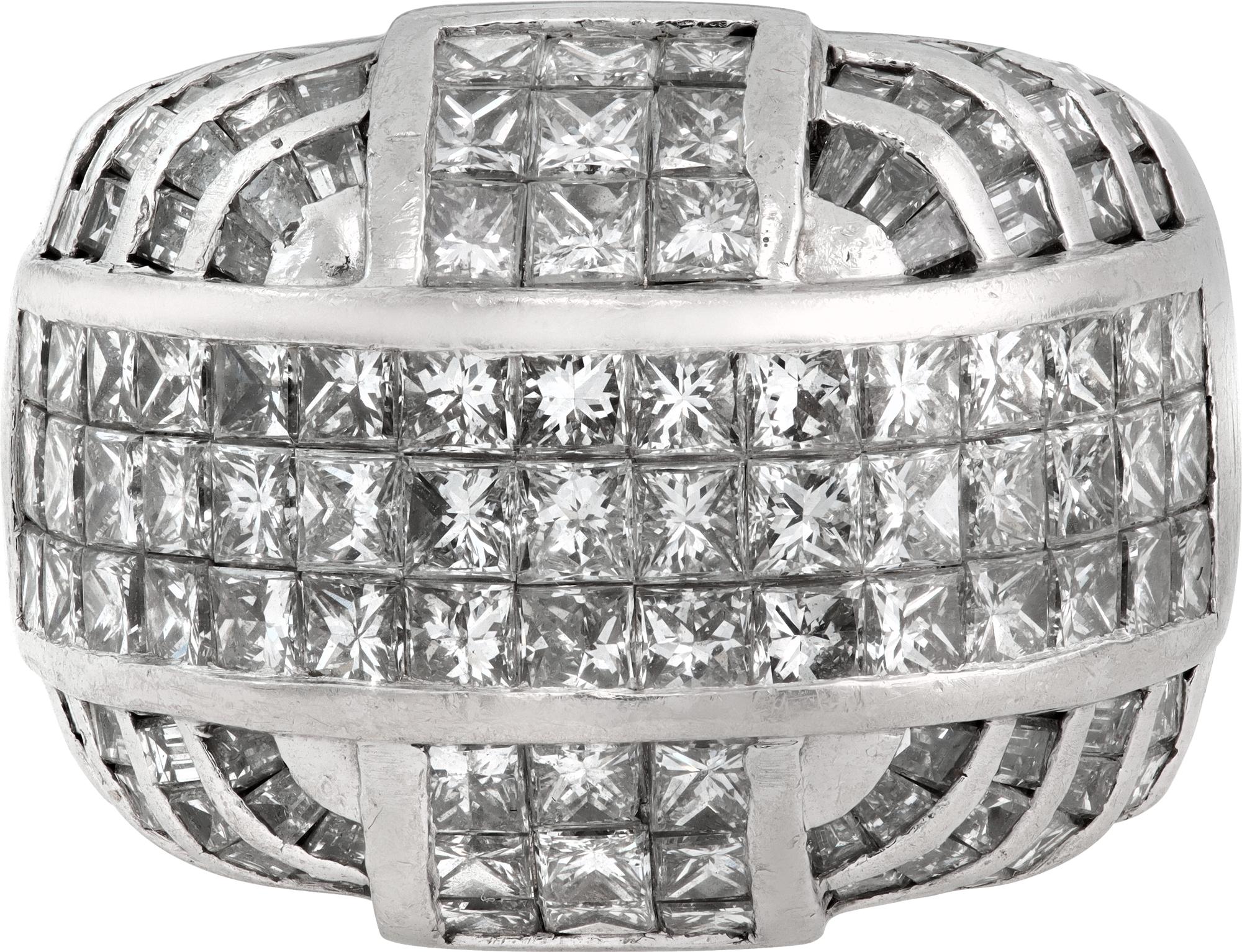 Bold Dome diamond ring in platinum with over 5 carats in princess cut invisible setting and baguetts diamonds. Approx G color VS clarity. Size 9.5

This Diamond ring is currently size 9.5 and some items can be sized up or down, please ask! It weighs