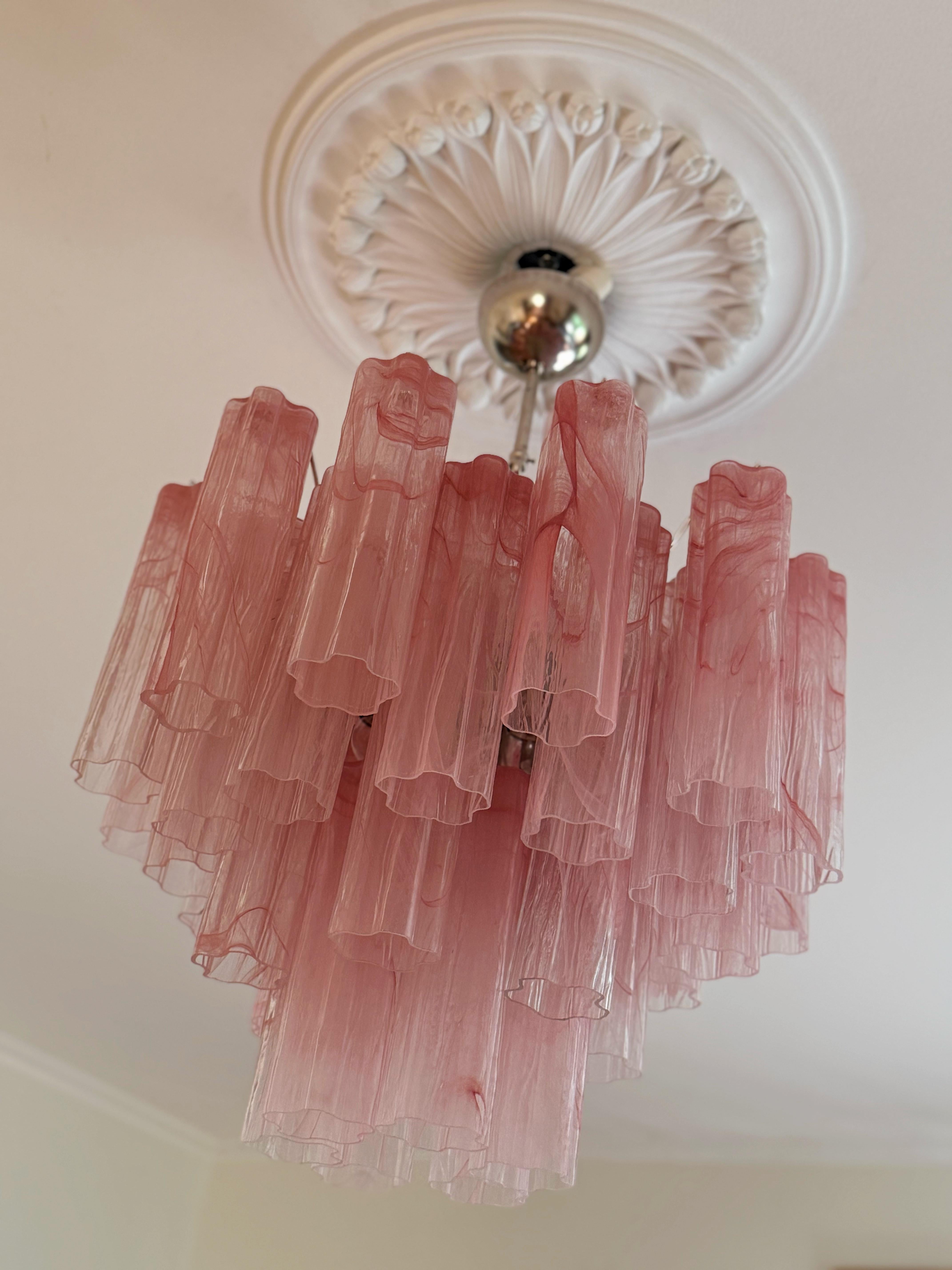 Elegant, Bold Pink Murano Chandelier. Tubular Tronchi Formed Glass Prisms in pink tones with a swirled marble pattern. Traditional Italian Mid-Century Style.
The murano fixture is composed of 36 Glass Elements in the size of 25 x7 cm (9.9