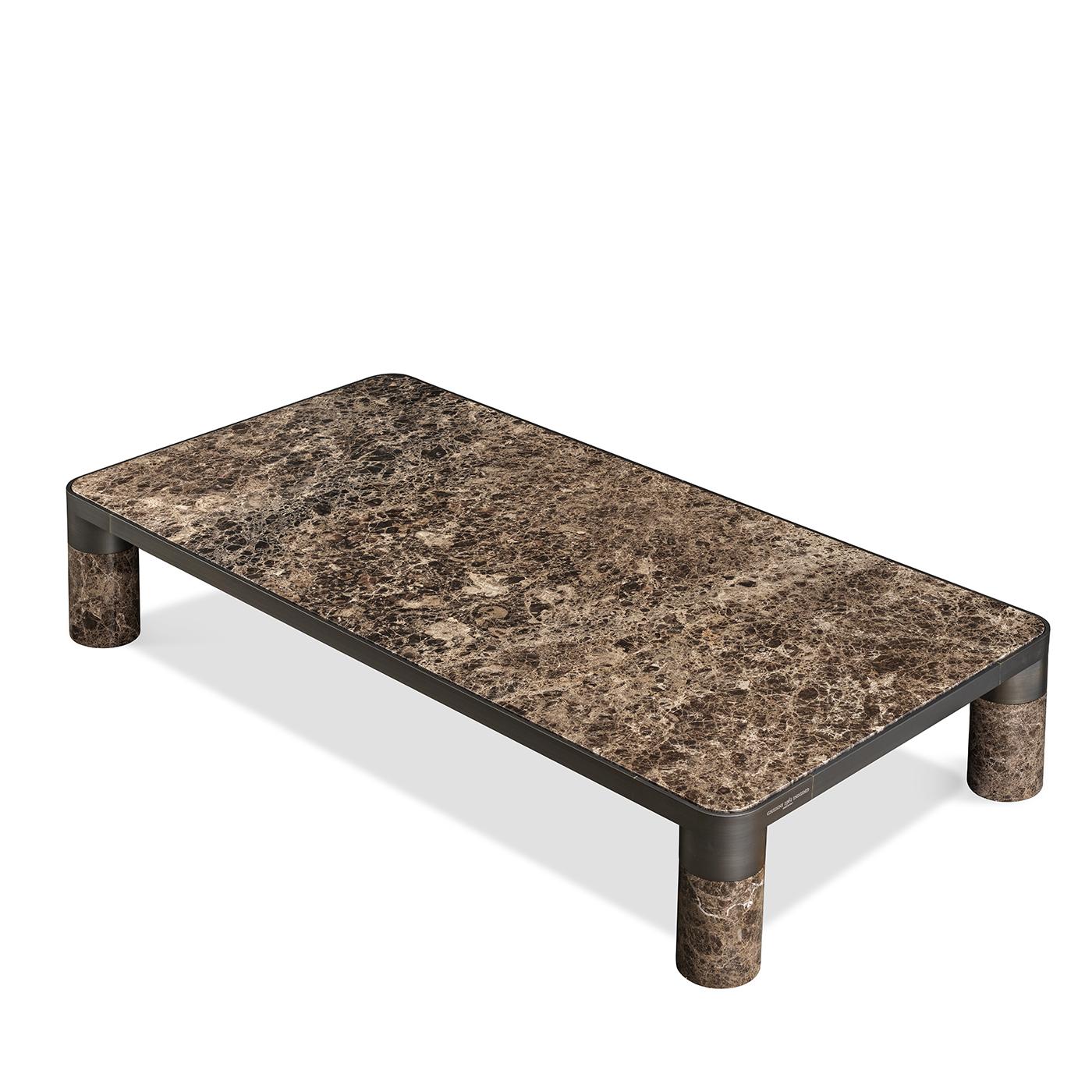 Showcasing a minimalistic and refined design exquisitely handcrafted of dark Emperador marble, this coffee table will make a bold and stately addition to a modern decor. Its sleek and sturdy silhouette is completed with a black satin-finished brass