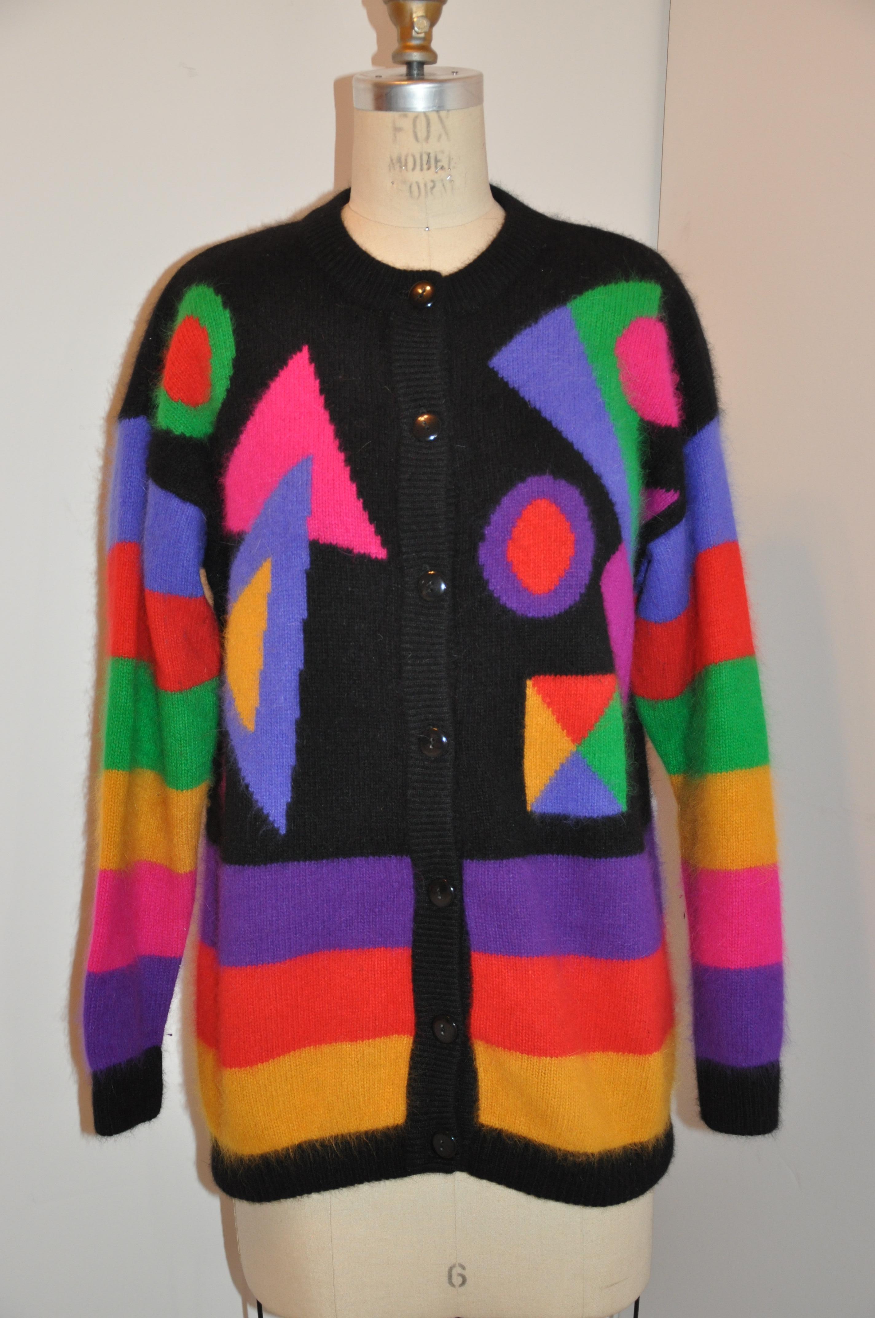    This Whimsical bold eye-popping multicolored abstract color block angora and lambswool blend  button-front sweater haas optional removable shoulder pads. Slight drop shoulders, from neck-to-sleeves-cuff measures 28 1/2 inches. Shoulders across