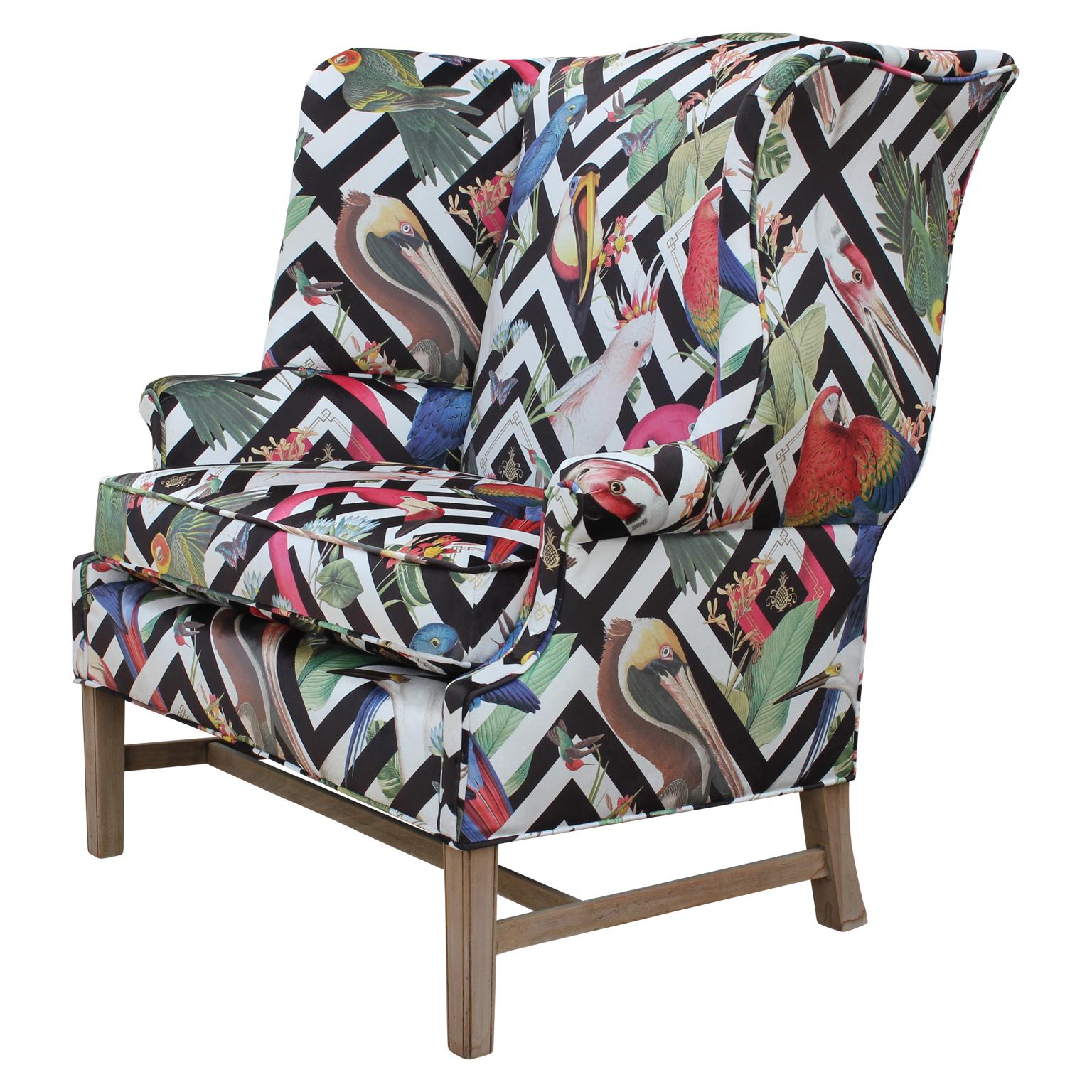 Bold Geometric modern tropical bird fabric wingback chair and a half / small settee / loveseat.

Mid-20th century wingback chair and a half customized in a stunning divine savages tropical geometric velvet. The tropical birds pop against the black