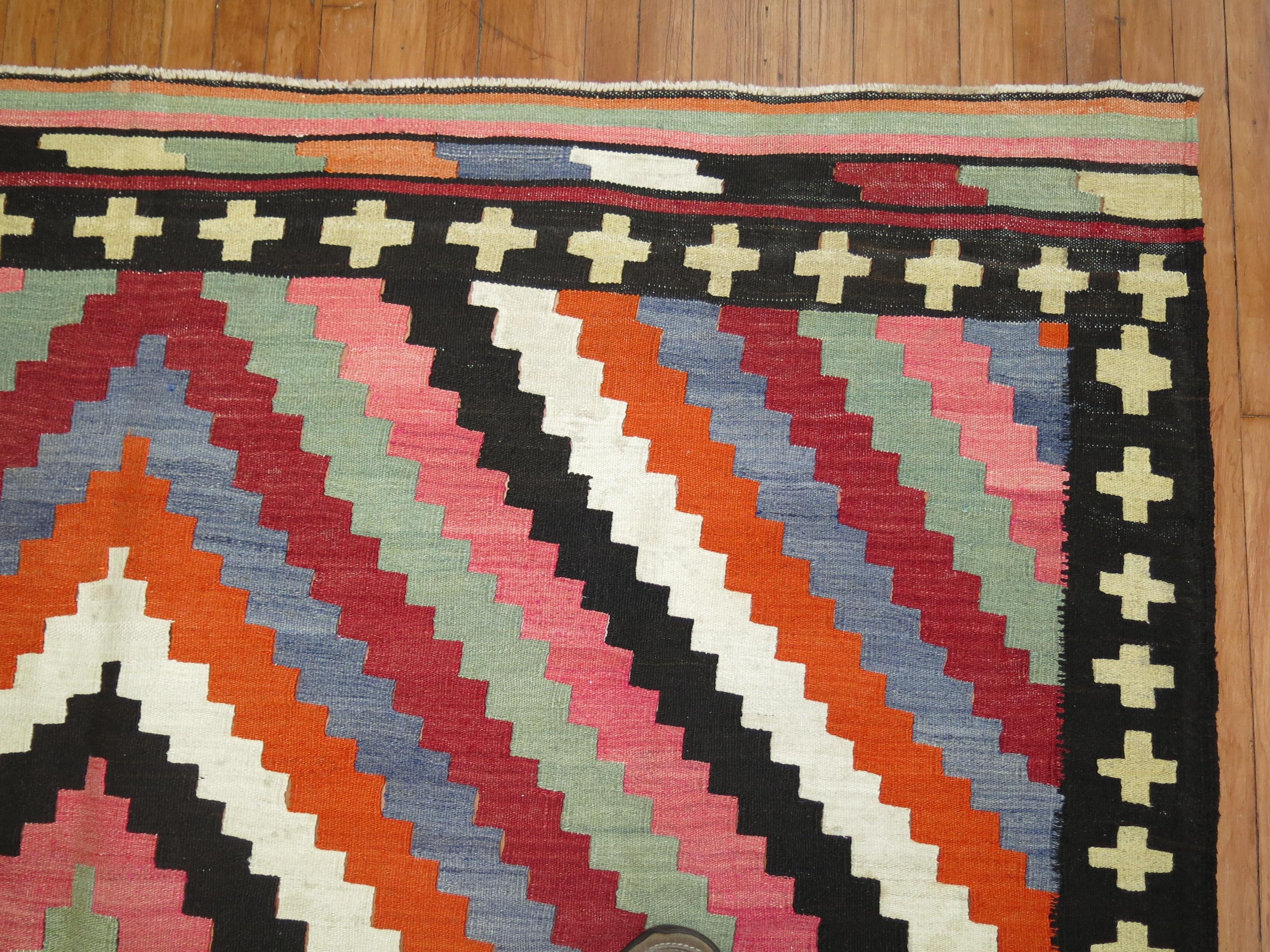 Dynamic bold color Mid-20th Century square room size Turkish Kilim

Measures: 7'5'' x 8'10''.