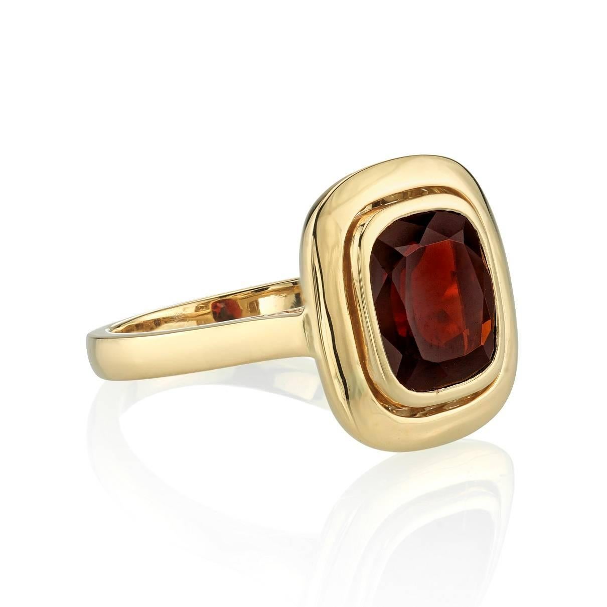 3.43ct Garnet set in a handcrafted 18k yellow gold setting. Ring is currently a size 6 and can be sized to fit.