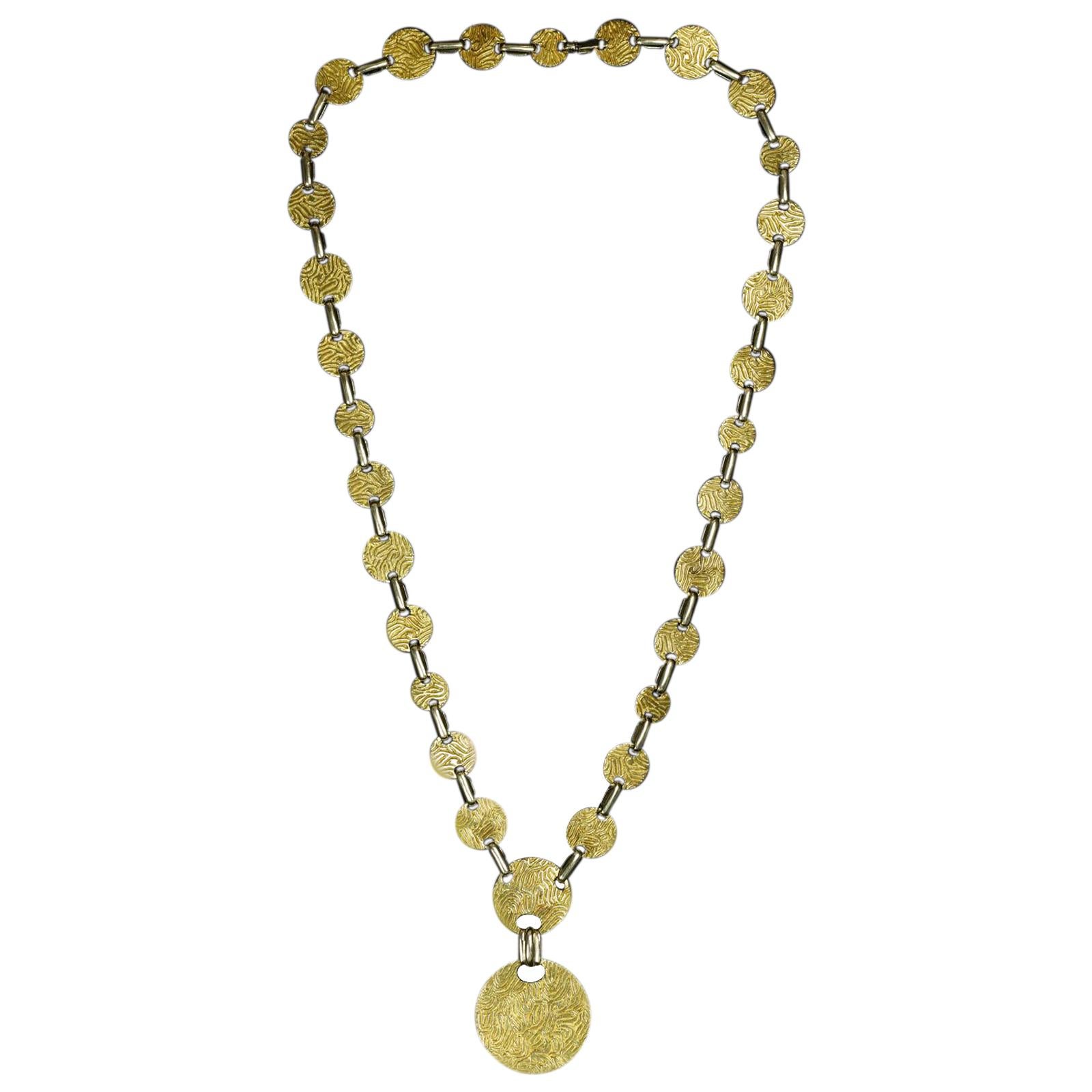 Bold Gold Long Sautoir Necklace with Patterned Discs by Cartier, circa 1960s