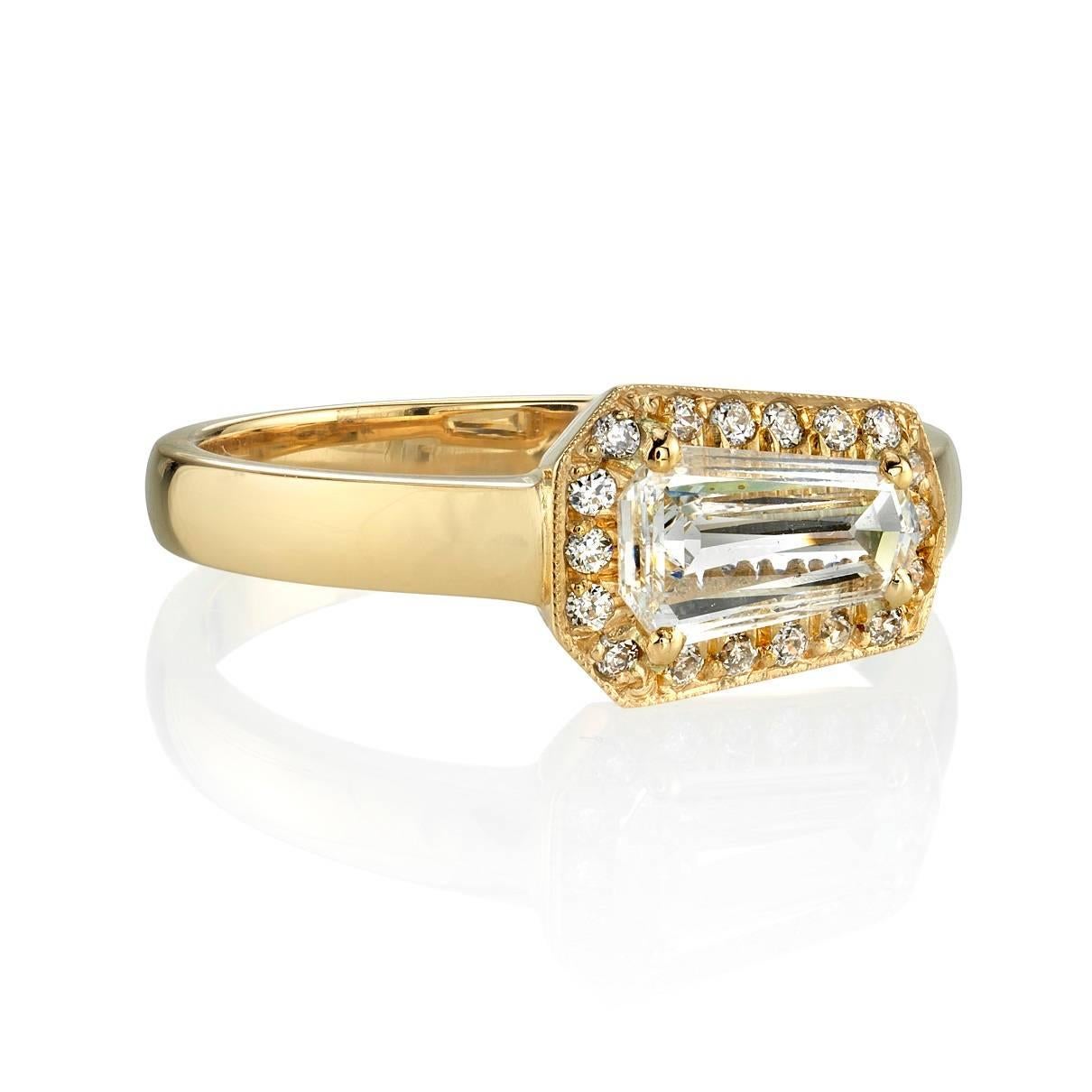 0.47ct F/SI1 EGL certified Shield cut diamond set in a handcrafted 18k yellow gold mounting. This bold engagement ring features a unique center stone and a striking profile.