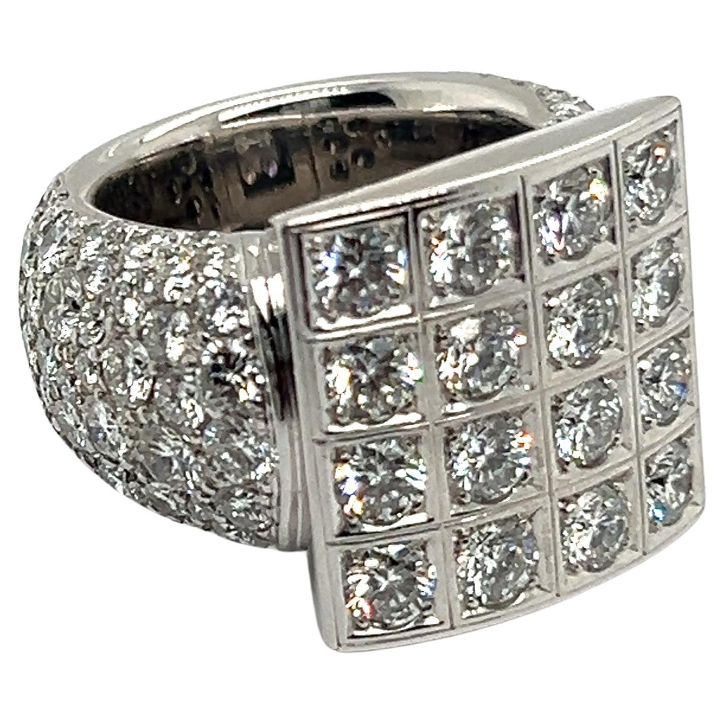 A radiant symbol of luxury and style - this bold ring truly embodying the essence of 80's graphic glamour!  It features a captivating pattern of 16 brilliant-cut diamonds, totaling 2.40 carats, each boasting an F-G color and vs clarity. The