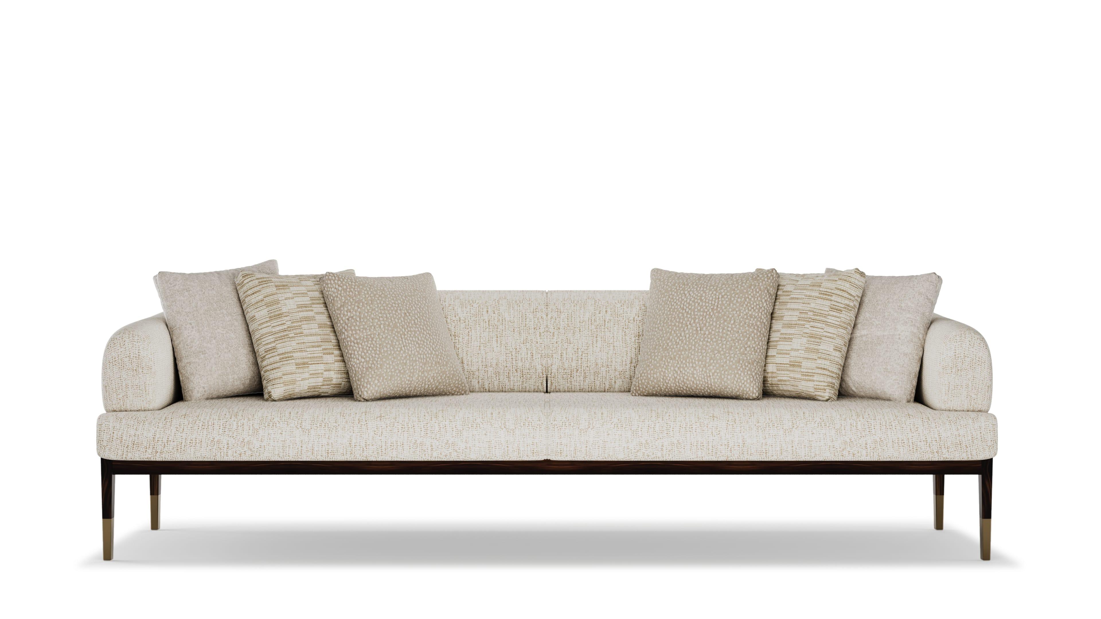 The Gulliver Sofa is a refined expression of modern elegance and comfort, designed to bring effortless sophistication to any living space. With its structured silhouette, plush upholstery, and sleek wooden frame with metal accents, the Gulliver