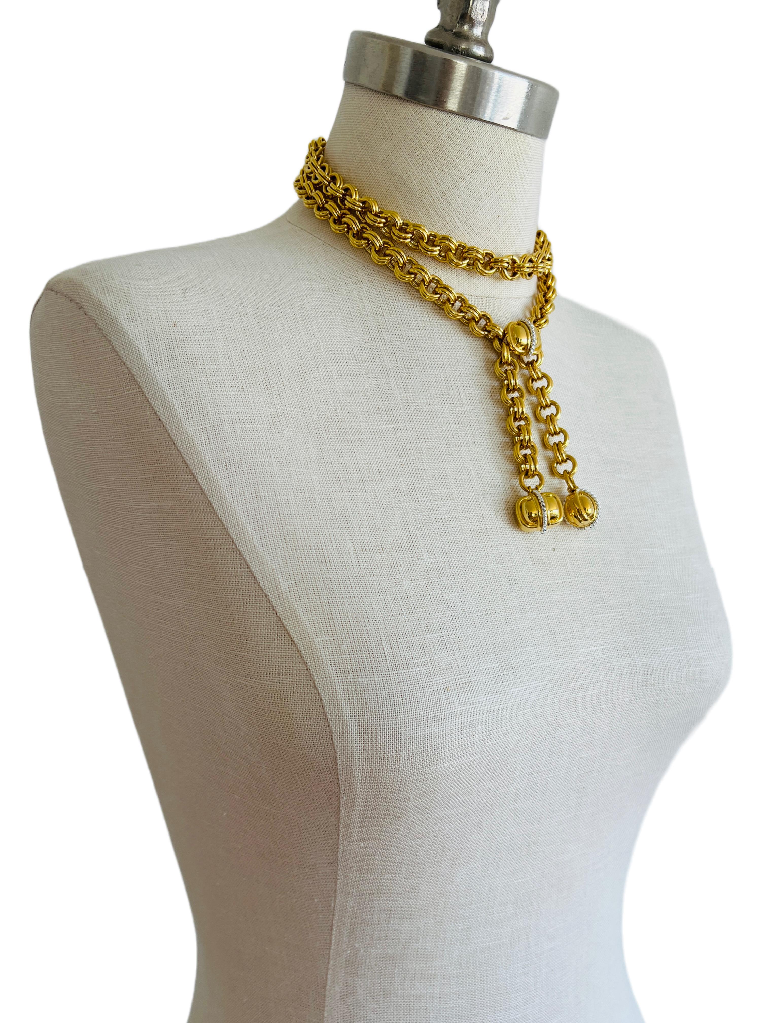 This vintage gold plated necklace is very versatile and quite heavy (195.9 grams). The center piece is a detachable clasp that can be reattached at any length. It can be worn doubled over as choker, long or in between. It can also be worn as a belt!