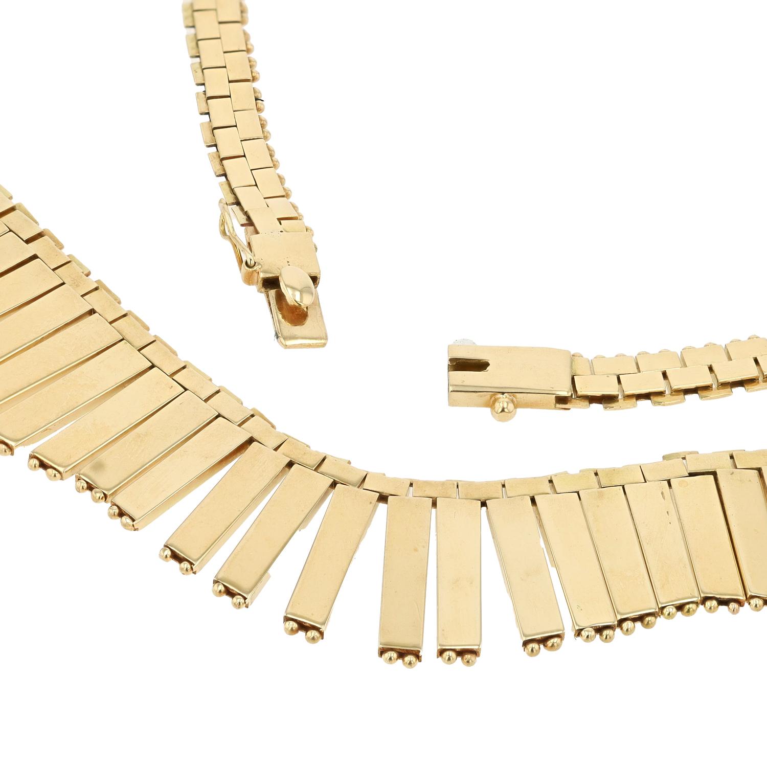 Calling all Cleopatras and lovers of Egyptian revival jewelry. Channel your inner queen when wearing this bold, vintage Italian 18k gold scalloped fringe bib necklace. Draping around your neck with lithe movement and consummate grace, each