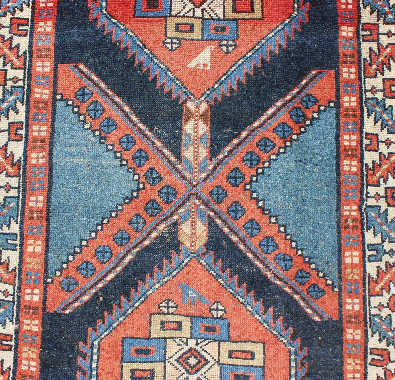 Wool Bold Medallion Design Antique Persian Heriz Runner in Red and Blue Tones For Sale