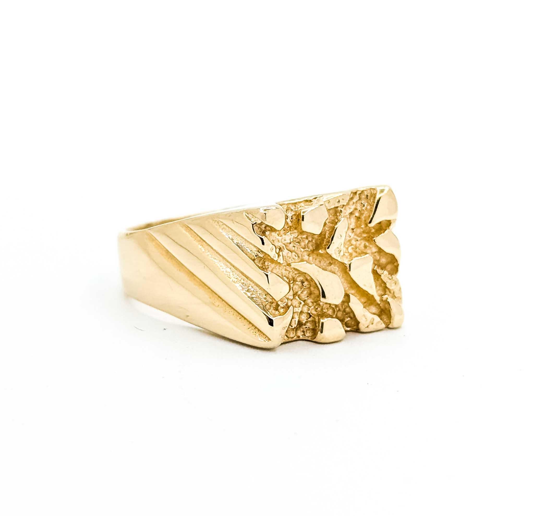 This striking men's ring features a bold nugget design carved in solid 14k yellow gold. Measuring 12mm across the top, the ring showcases a rugged, textured pattern that evokes the classic style of gold nugget jewelry—symbolizing strength and