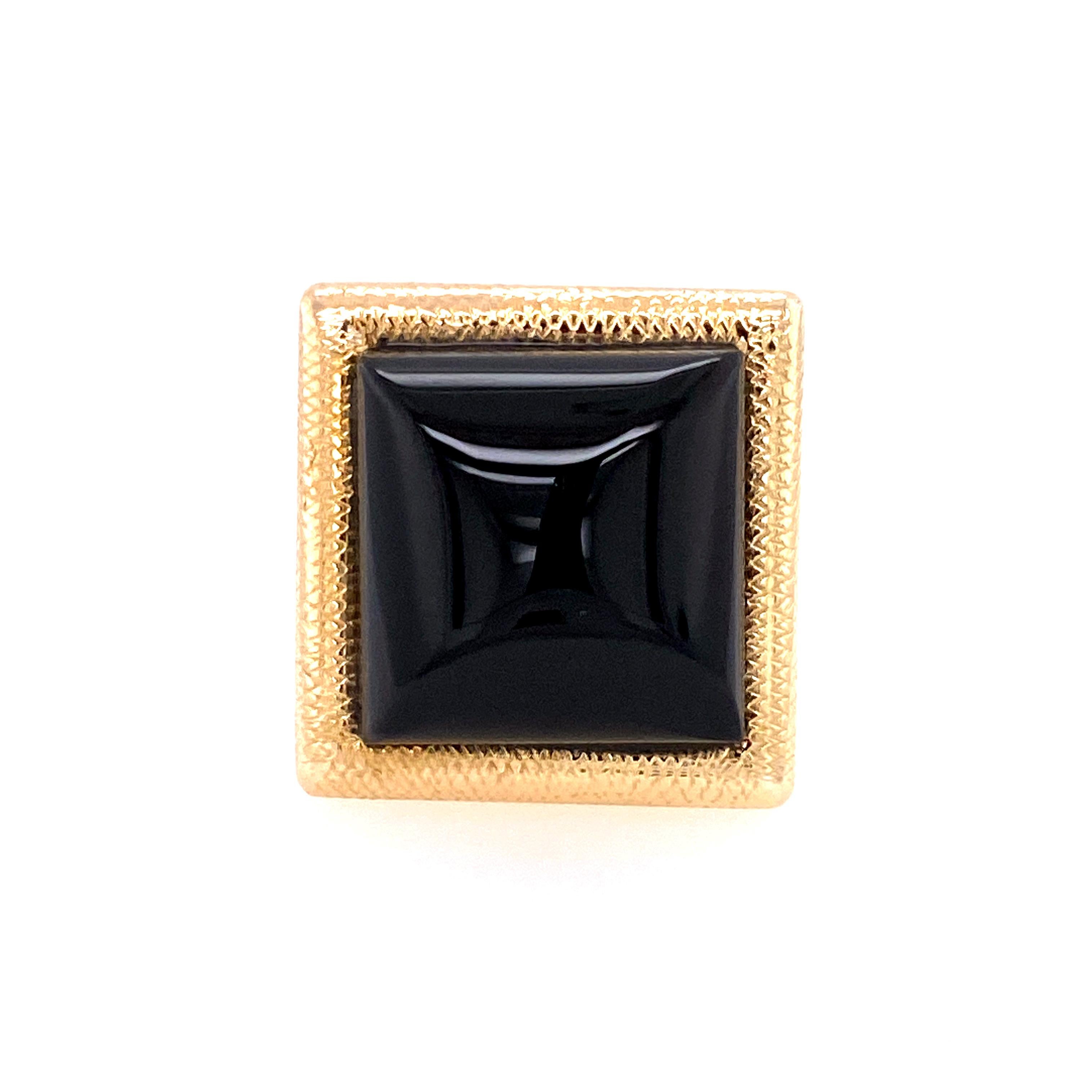 Most impressive ring:  large pyramid-shaped polished onyx ring.  Set to advantage in a  1