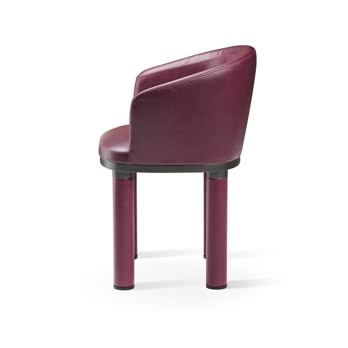 Distinguished by an eye-catching purple tone, this armchair will make an elegant statement in a contemporary interior, especially when paired with others from the same series for a refined and cohesive look. Simple yet stylish, it features a black