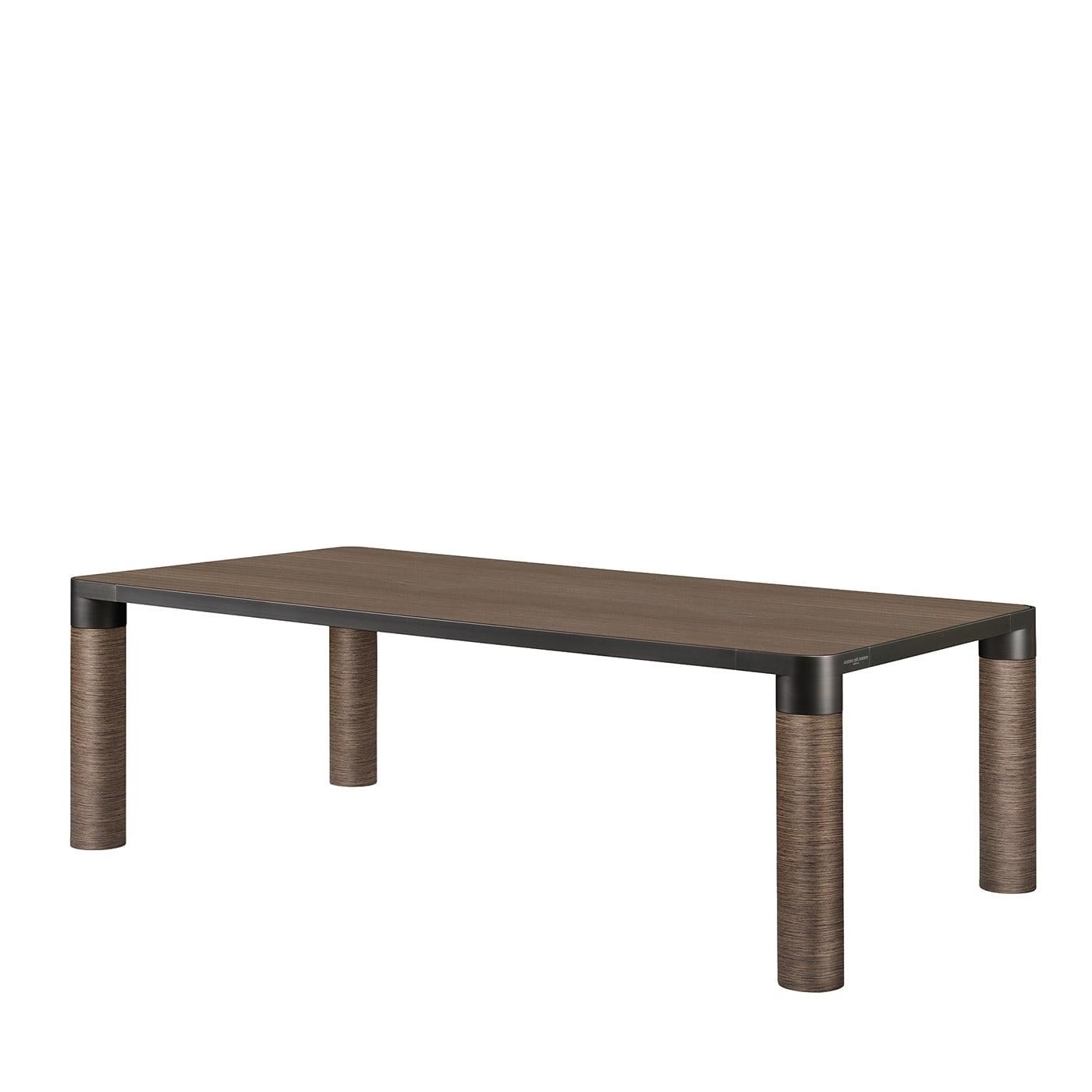 This refined dining table will impeccably complement modern dining rooms with a prevalence of neutrals. Its name is coherent with the essential yet stately silhouette, borrowing the reassuring charm of nature thanks to extensive use of wood that